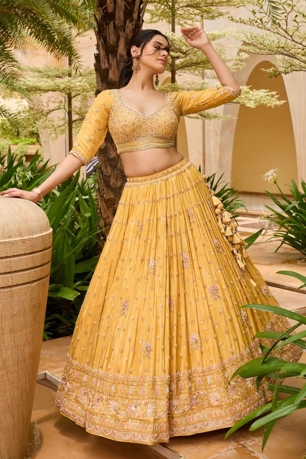 Yellow silk lehenga choli with sequins and hand cut dana work