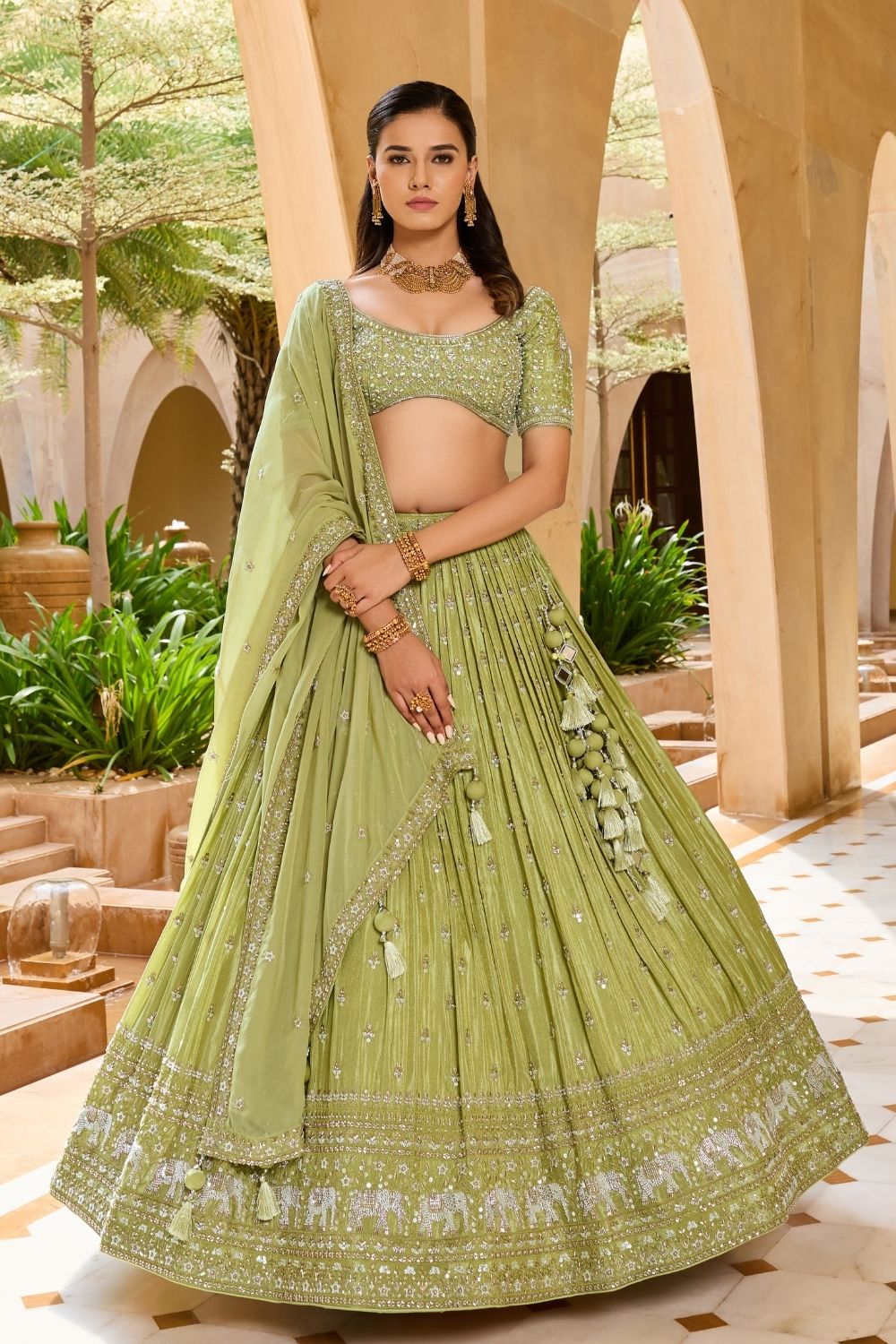 Palm green silk lehenga choli with sequins and hand cut dana work