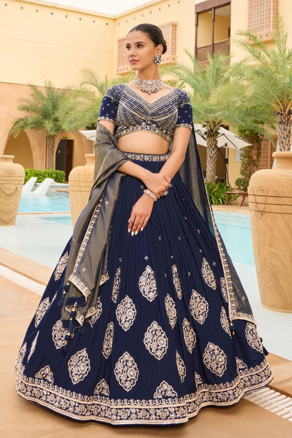 Royal blue silk lehenga choli with golden thread embroidery and sequins work
