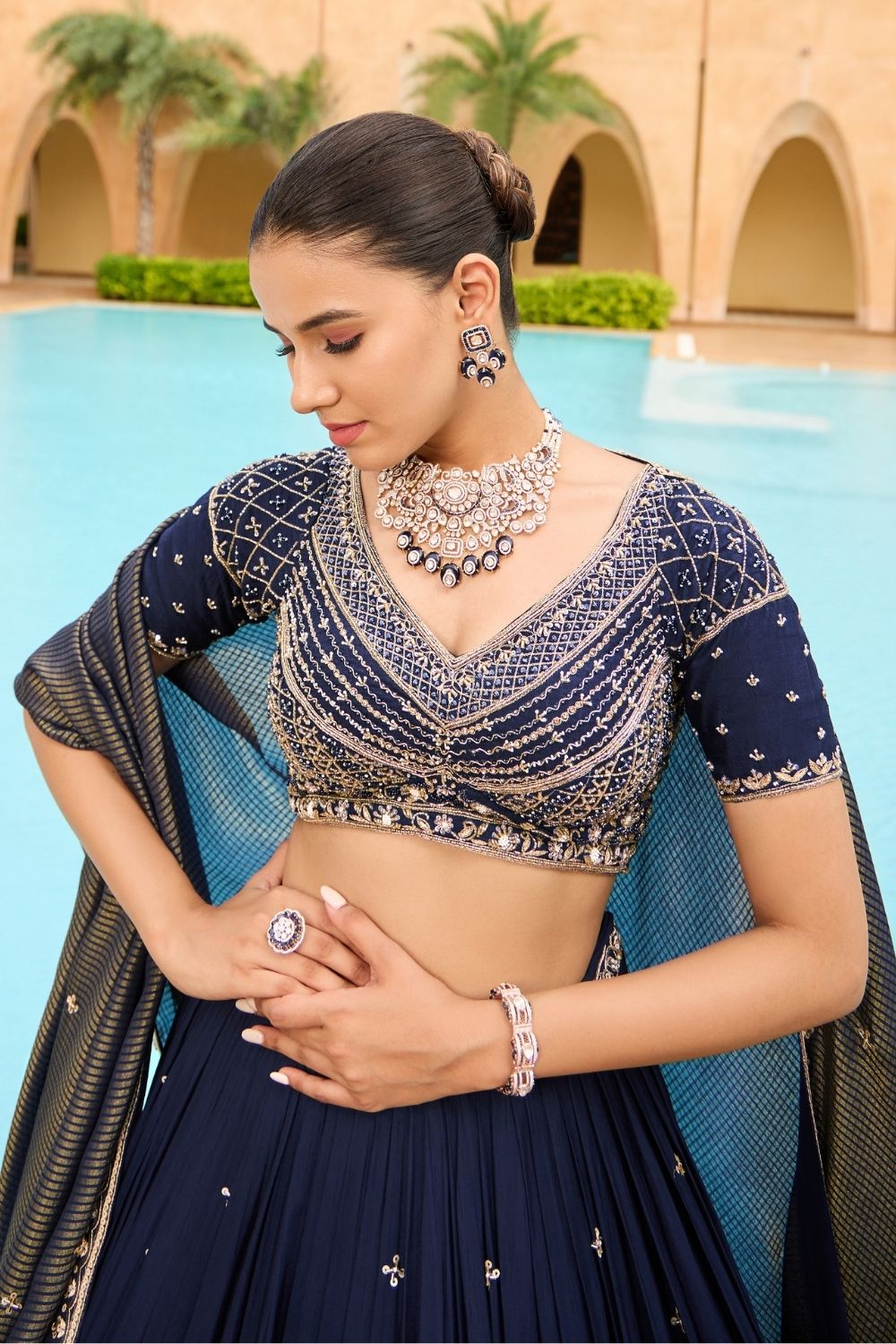 Royal blue silk lehenga choli with golden thread embroidery and sequins work