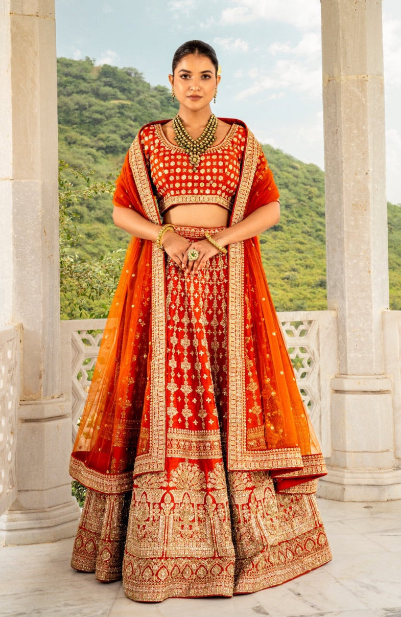 Coral orange raw silk lehenga choli with zardozi and hand cut dana work