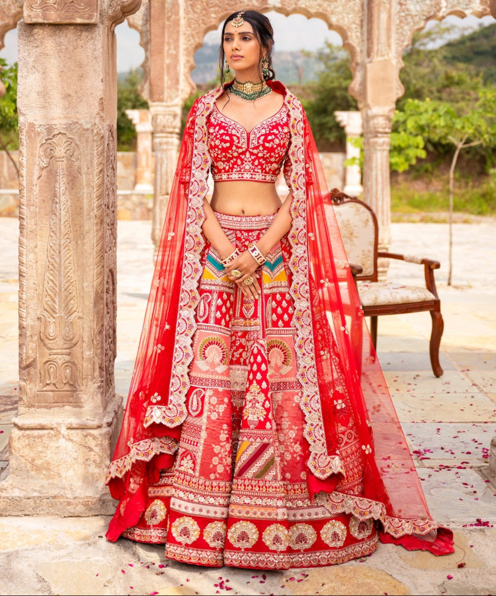 Bright red silk lehenga choli with hand thread work and moti work