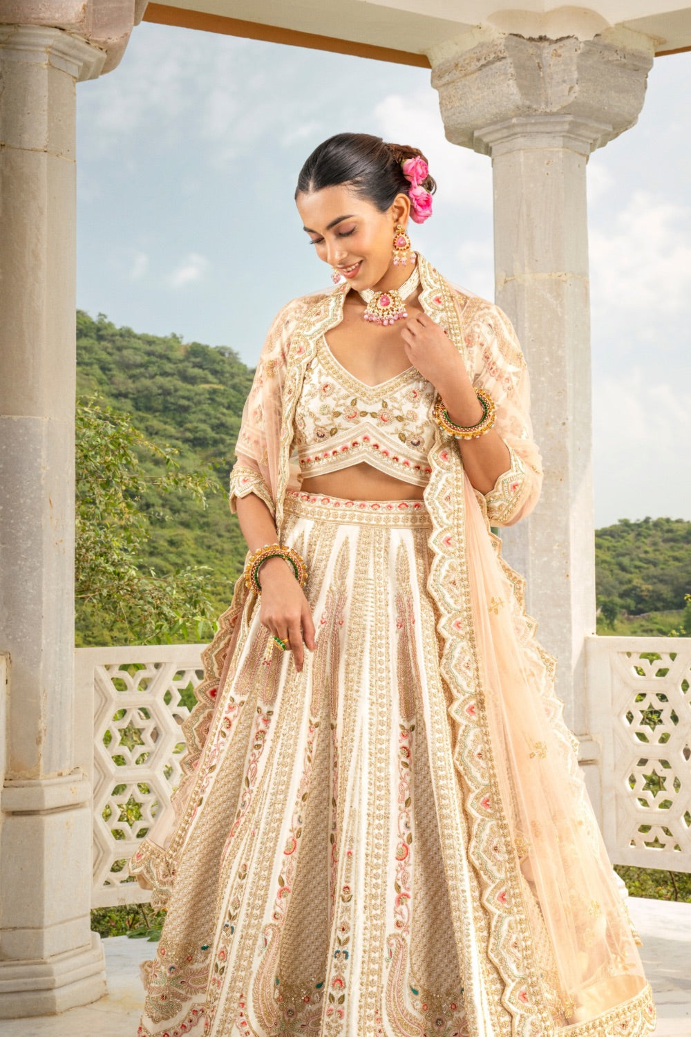Soft champagne raw silk zardozi embroidered lehenga choli with hand cut dana thread and pearl work