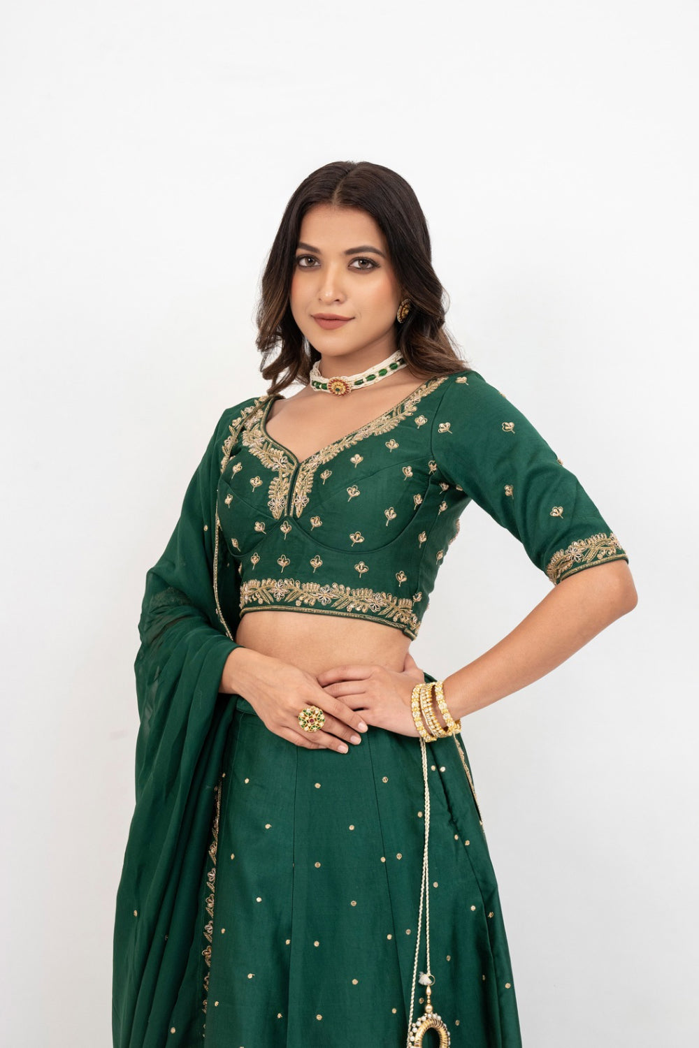 Bottle green soft silk zardozi embroidered lehenga choli with hand cut dana work