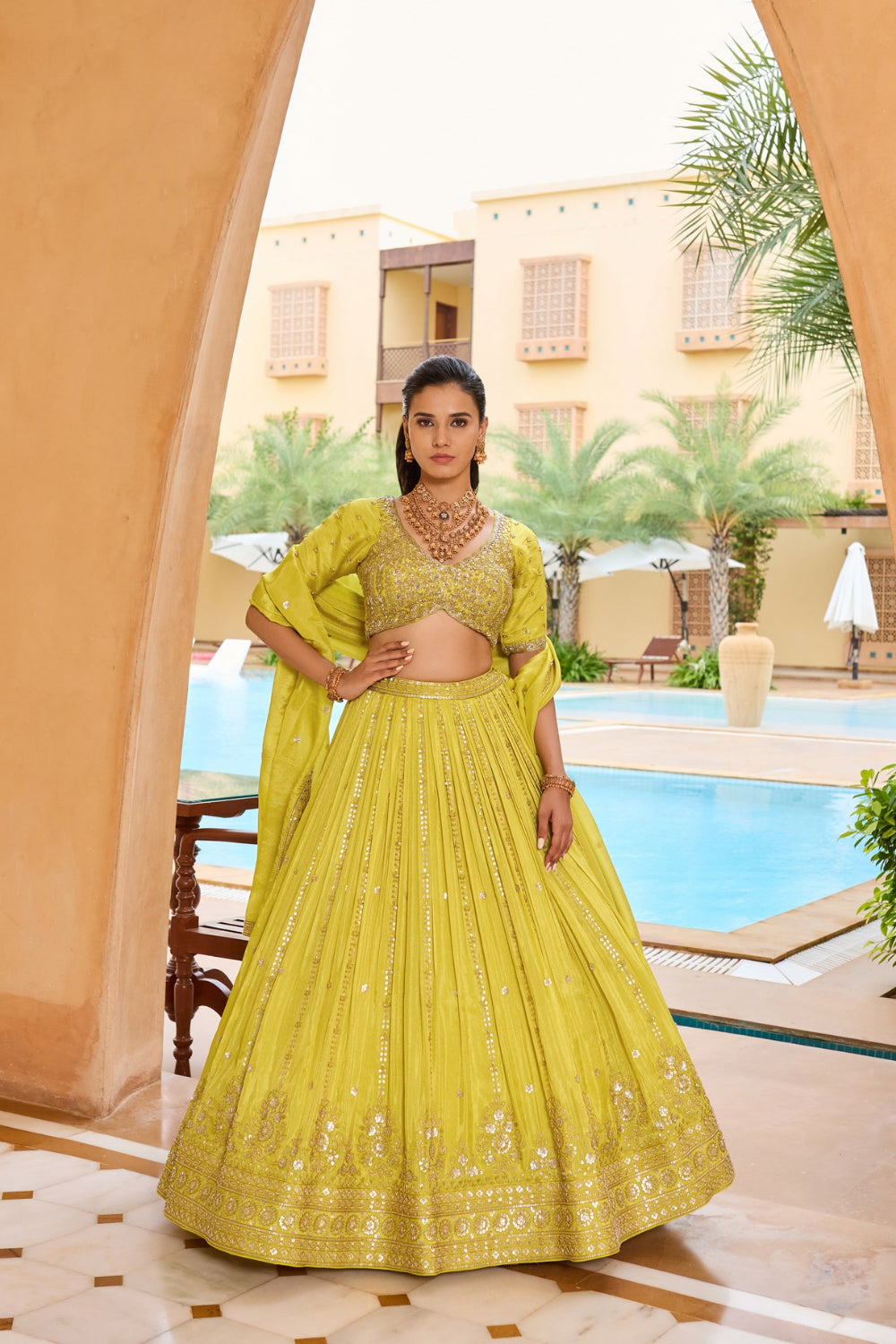 Lemon yellow silk lehenga choli with thread and sequins work