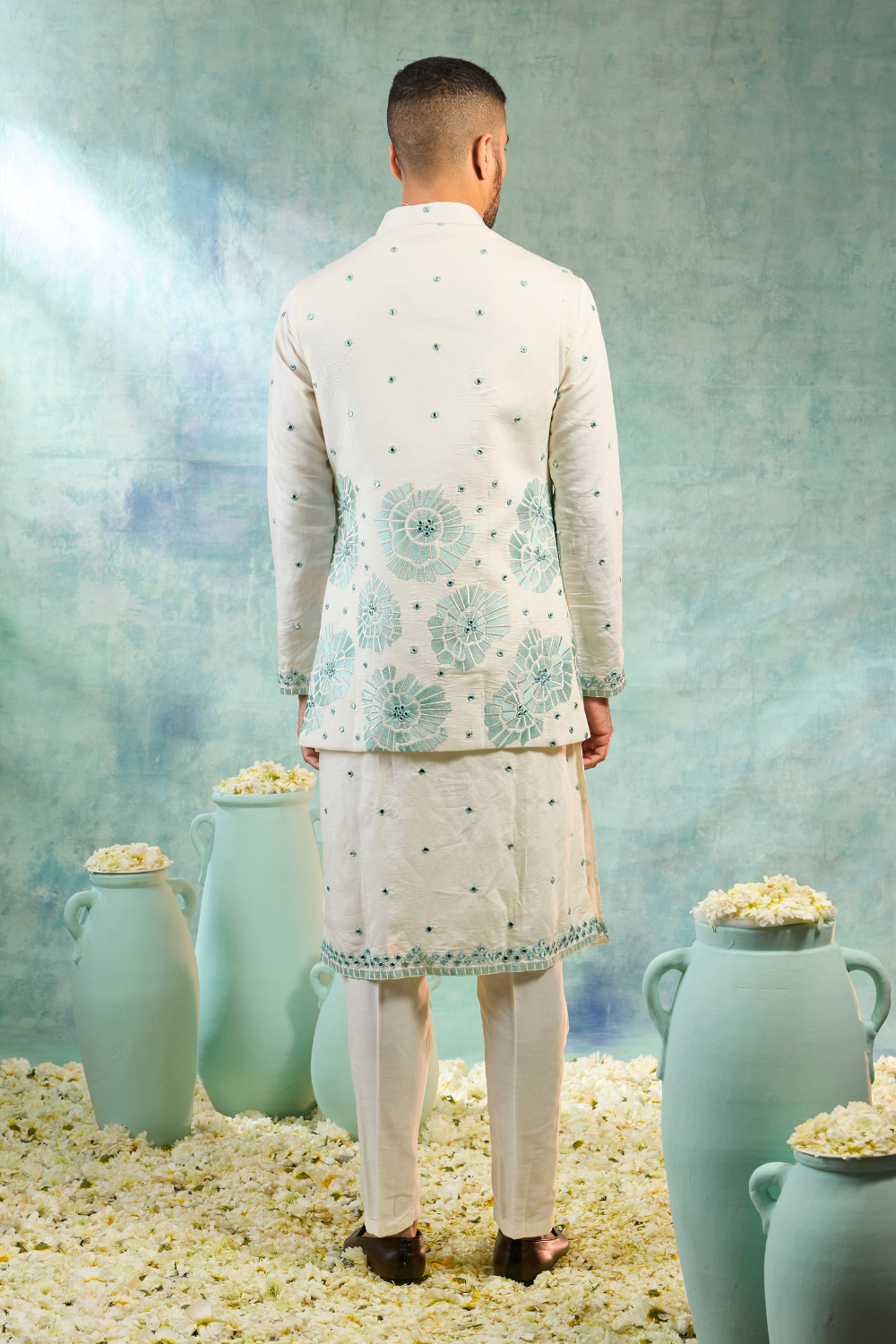 Pearl white kurta set with mint coloured thread work and mirror work