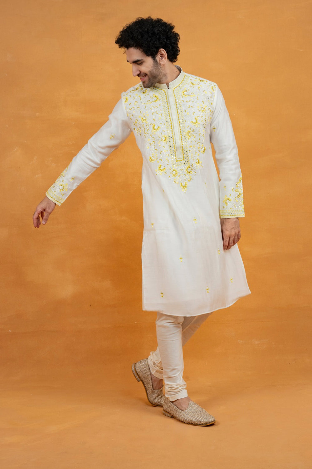 Silk kurta set with yellow resham embroidery and mirror work