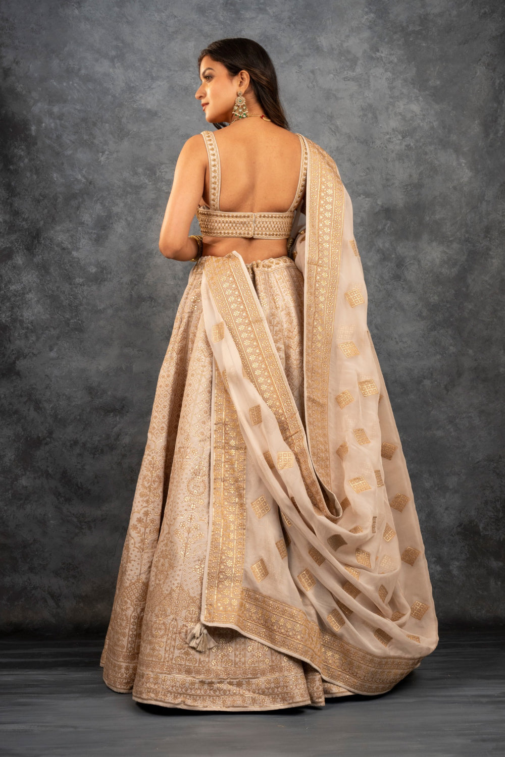 Beige banarasi silk lehenga choli with sequins hand cut dana and dori work