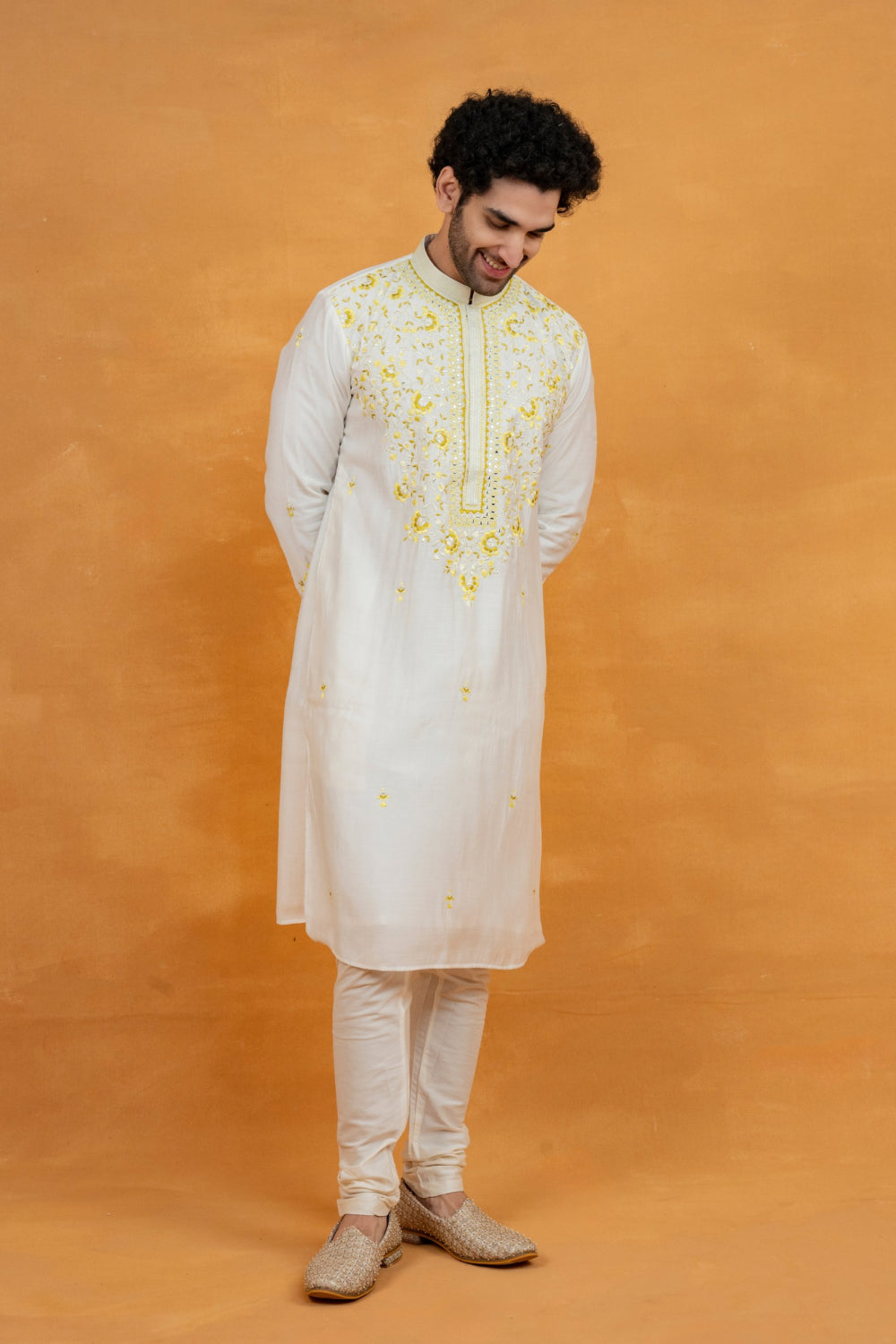 Silk kurta set with yellow resham embroidery and mirror work
