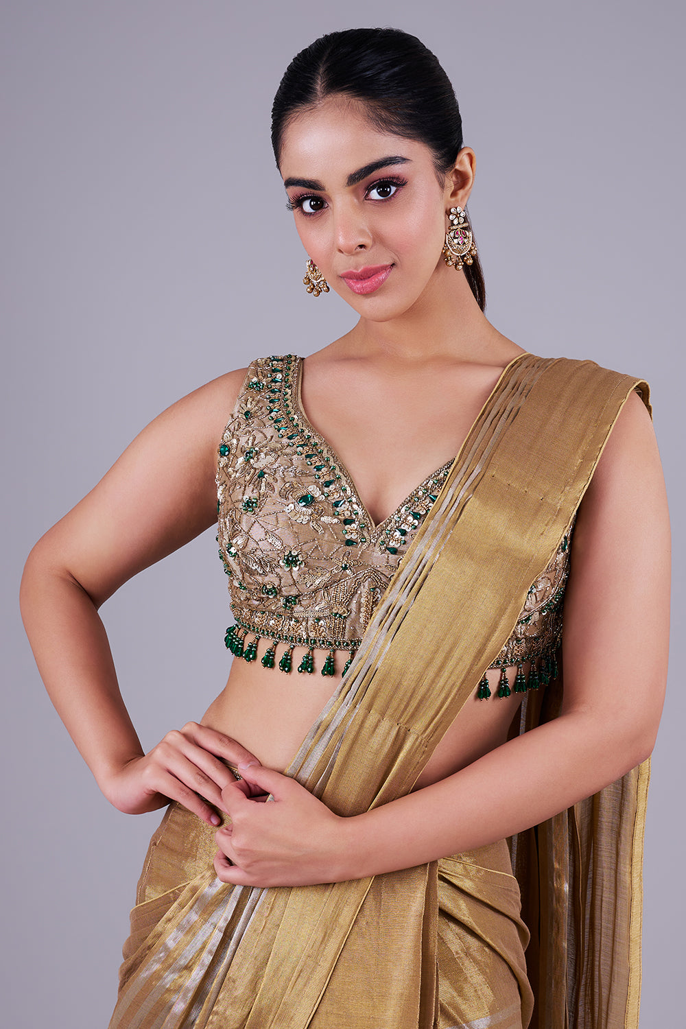 Antique gold drape with emerald blouse