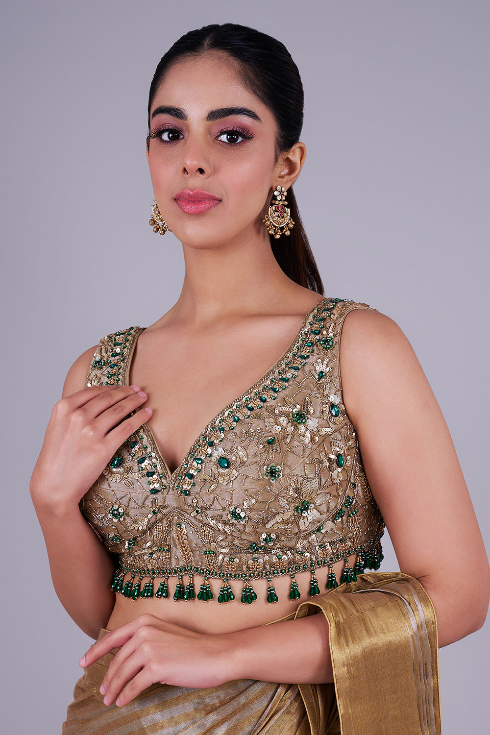 Antique gold drape with emerald blouse