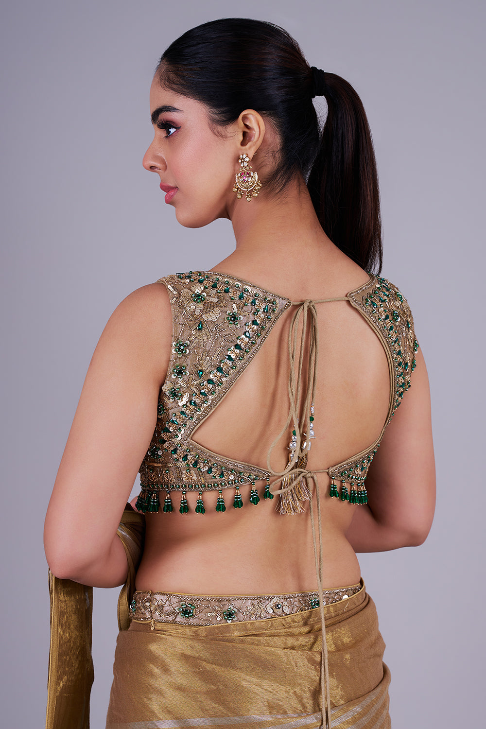 Antique gold drape with emerald blouse