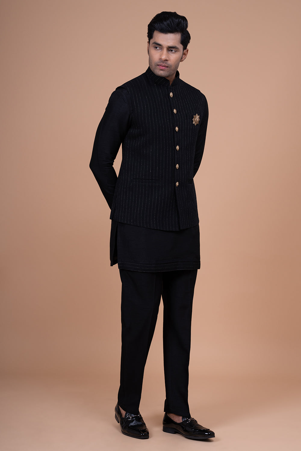 Black Pinstripe Nehru Jacket with Gold Buttons and Lion Crest Brooch.