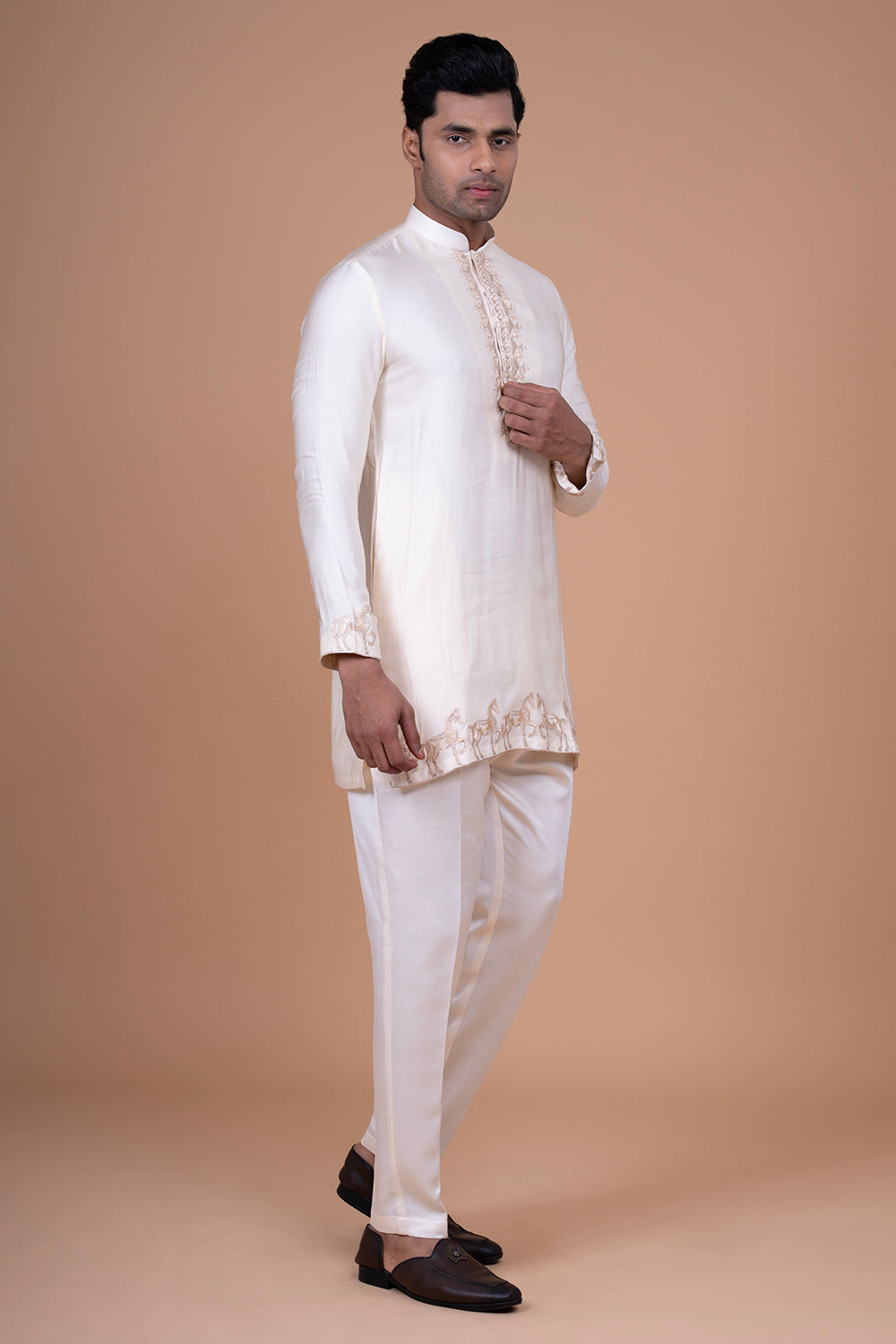 Ivory Raw Silk Sleeveless Bundi Jacket with Gold Zari Horse Embroidery.