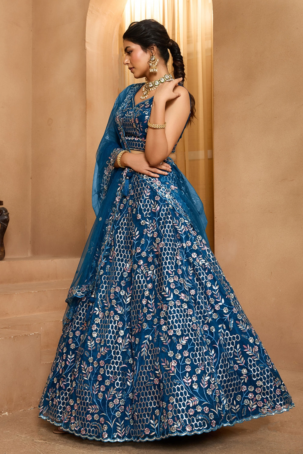 NET LEHENGA CHOLI WITH SEQUINS AND RESHAM EMBROIDERY