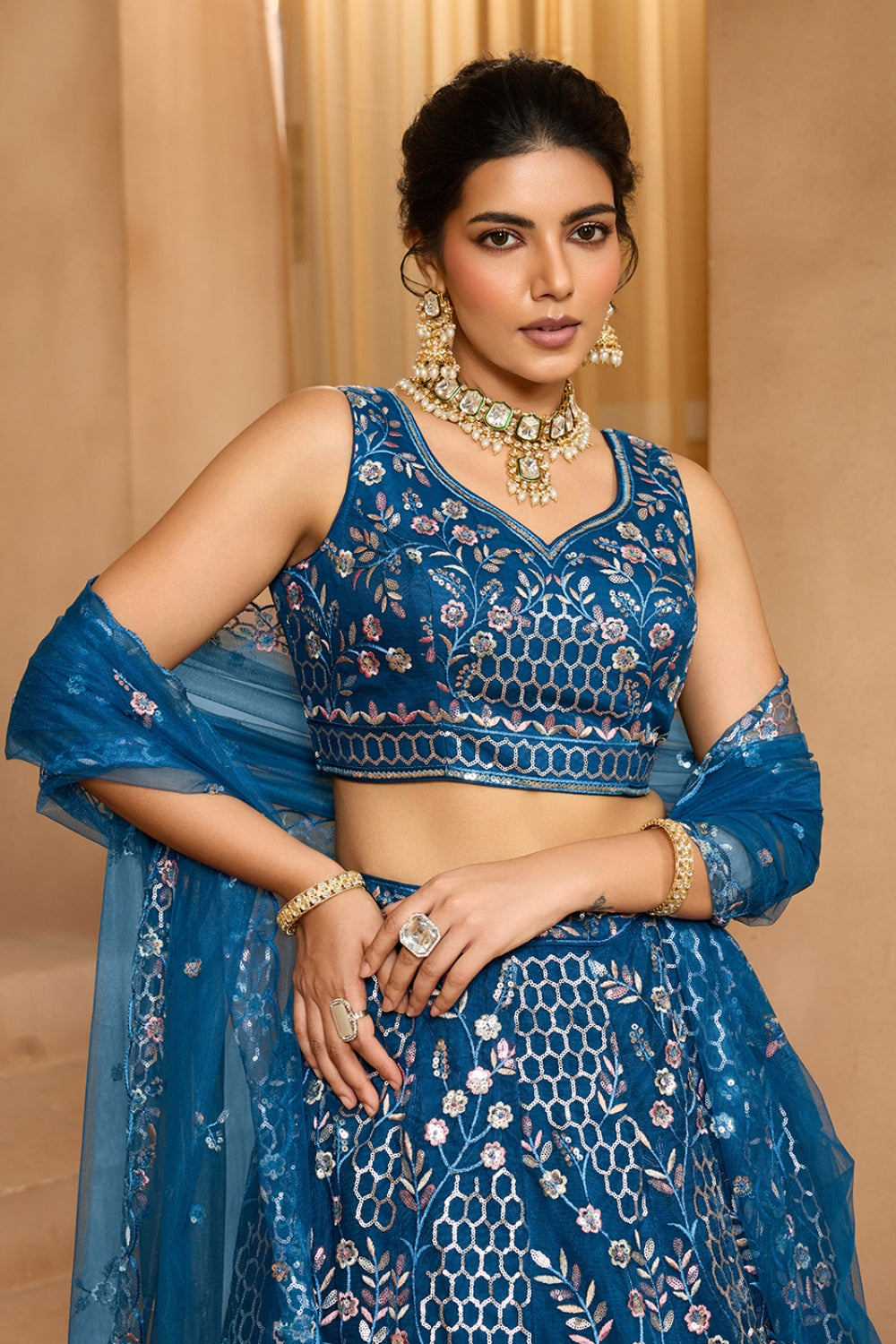 NET LEHENGA CHOLI WITH SEQUINS AND RESHAM EMBROIDERY