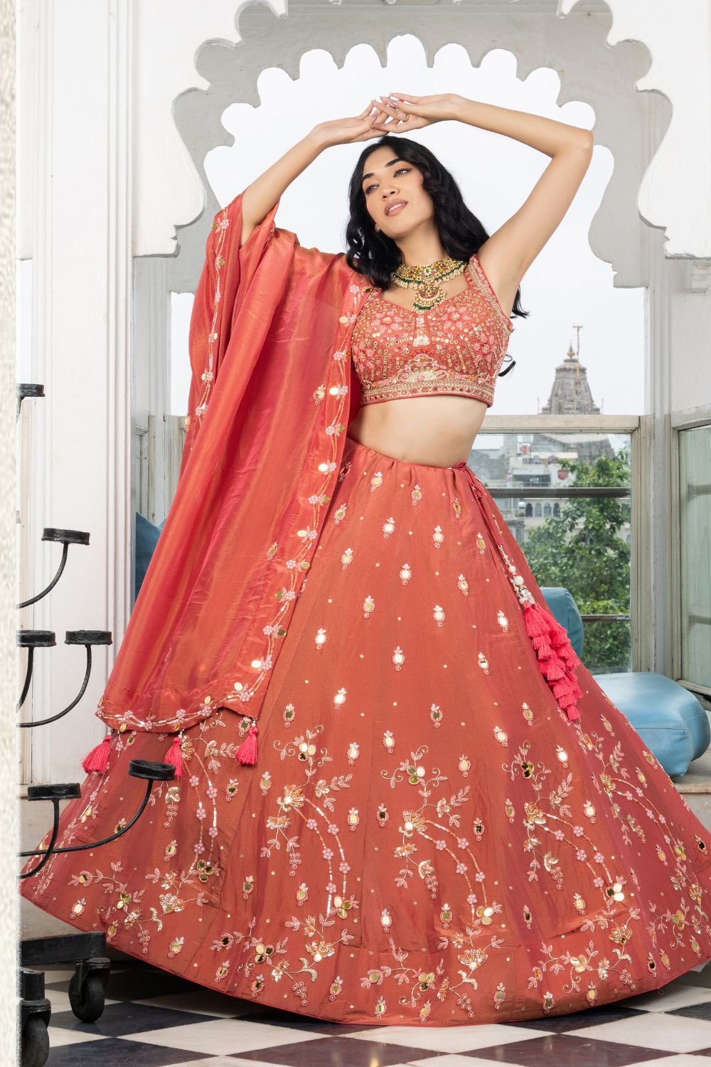 ORANGE TISSUE LEHENGA CHOLI WITH SEQUINES AND CUTDANA WORK