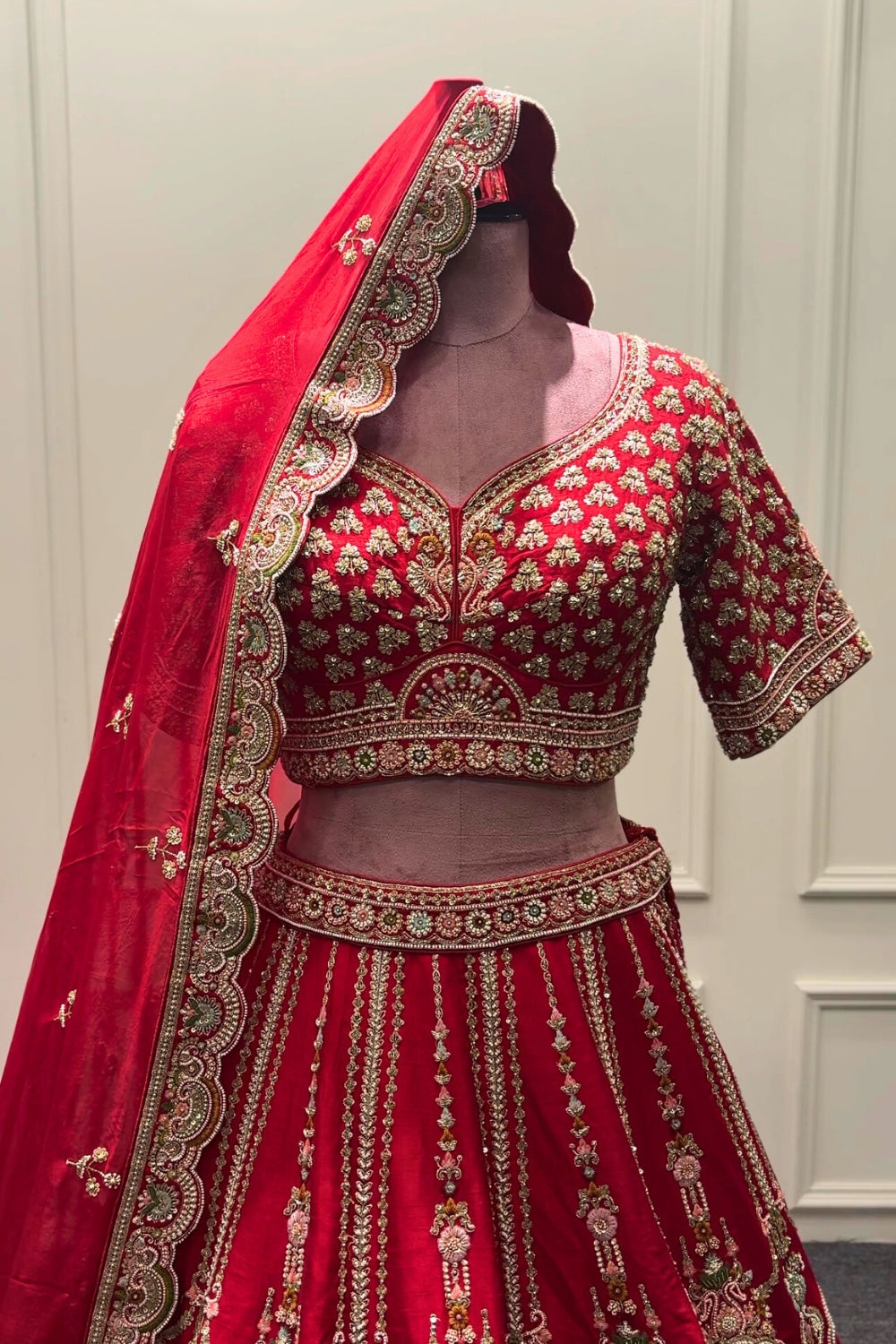 RED SILK BRIDAL LEHENGA SET WITH CUTDANA AND MOTI WORK