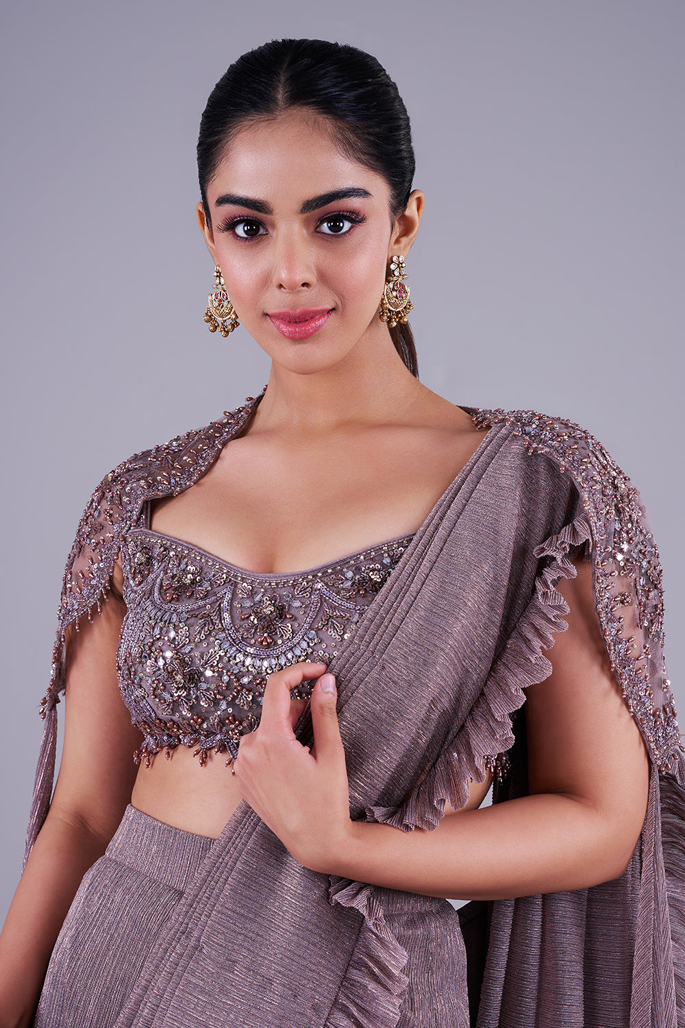 Taupe shimmer saree with embellished blouse & cape