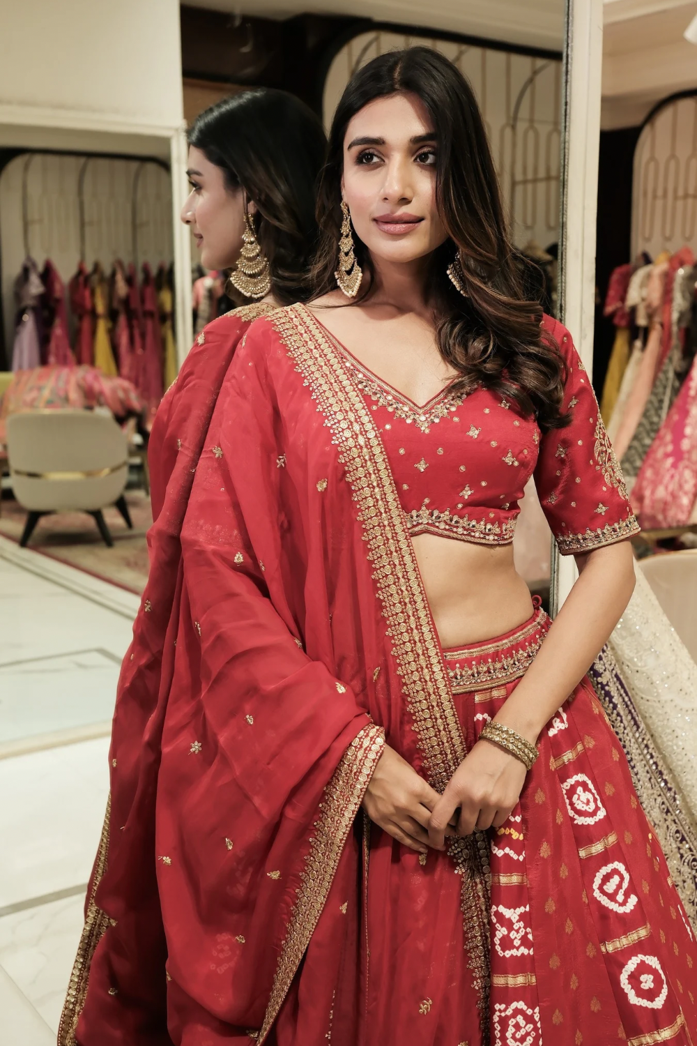 Red silk lehenga choli with mirror and pearl work