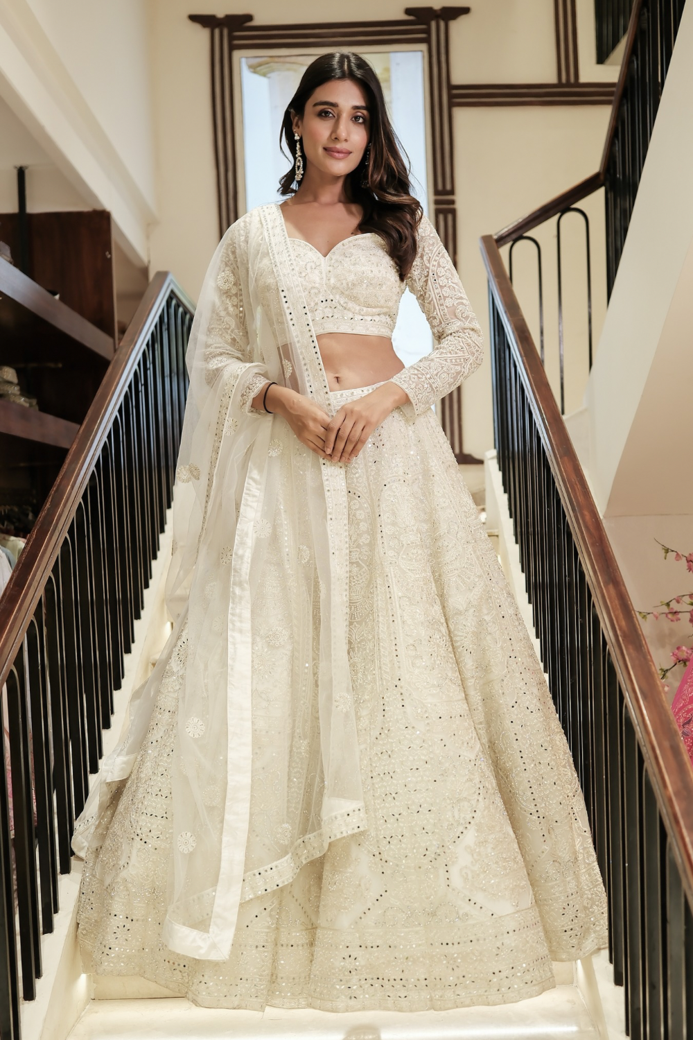 Off-white net lehenga choli with pearl and sequins work
