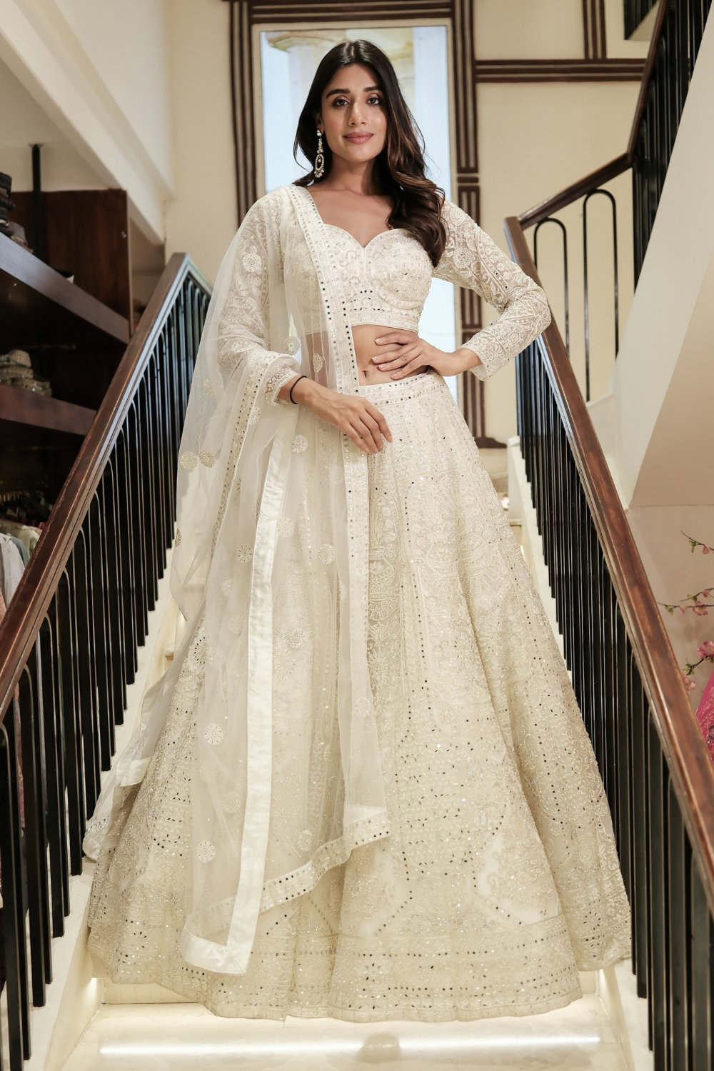 Off-white net lehenga choli with pearl and sequins work