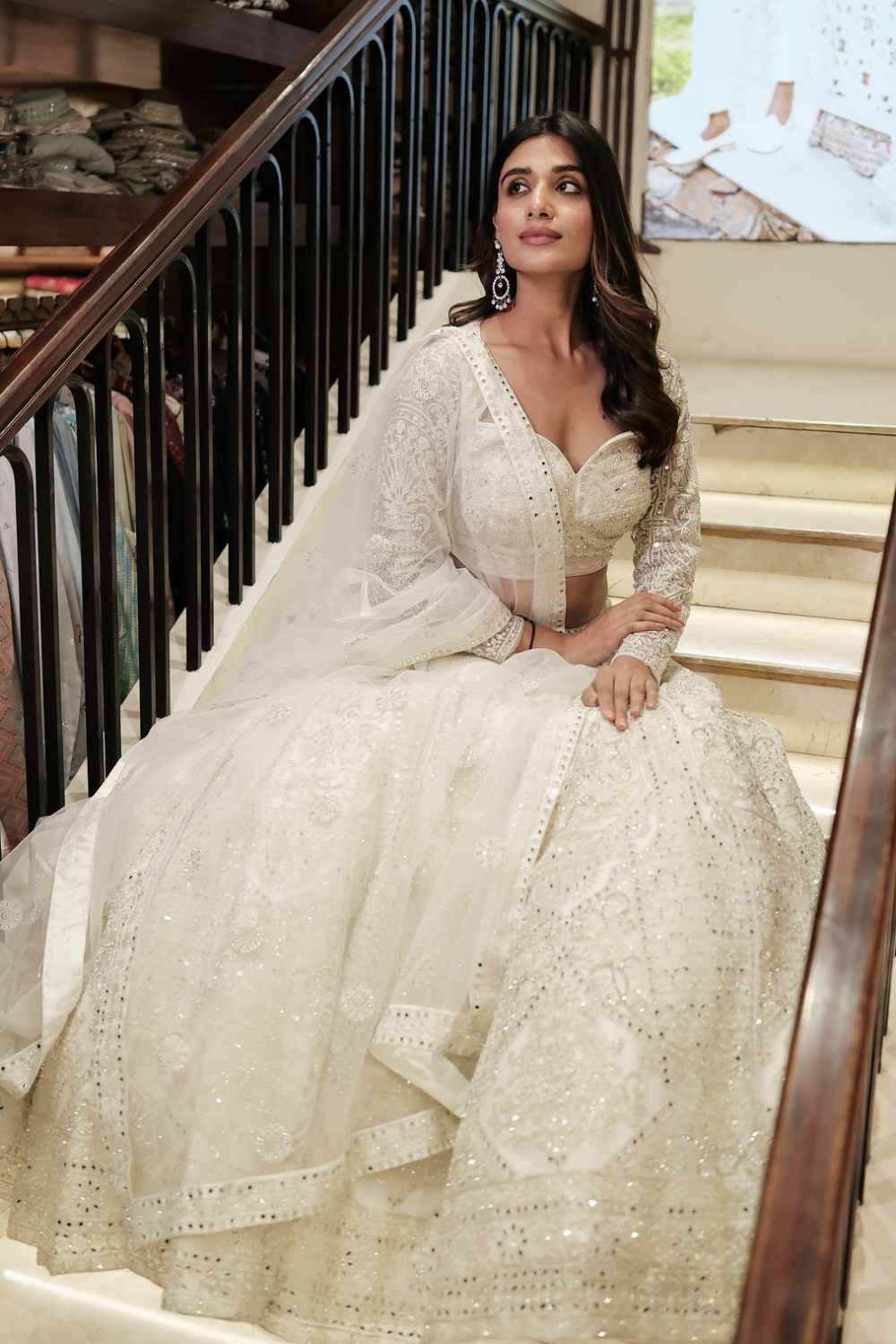 Off-white net lehenga choli with pearl and sequins work