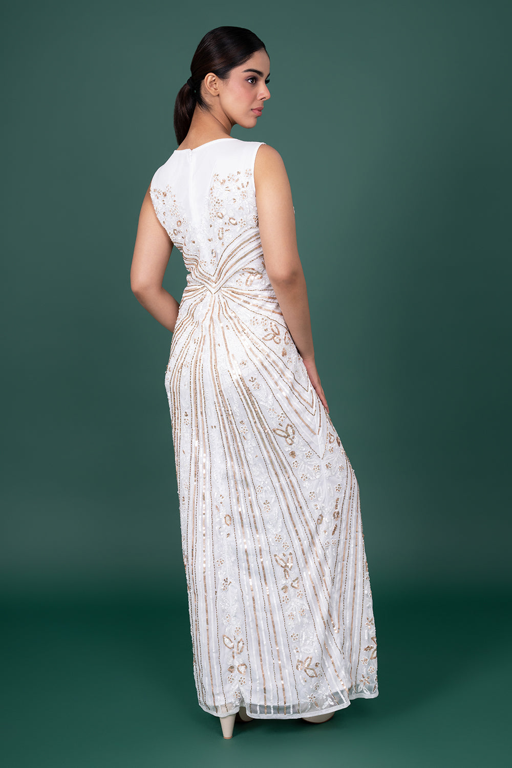 White Sleeveless Tulle Gown With Sunburst Gold Sequin And Floral Embroidery.