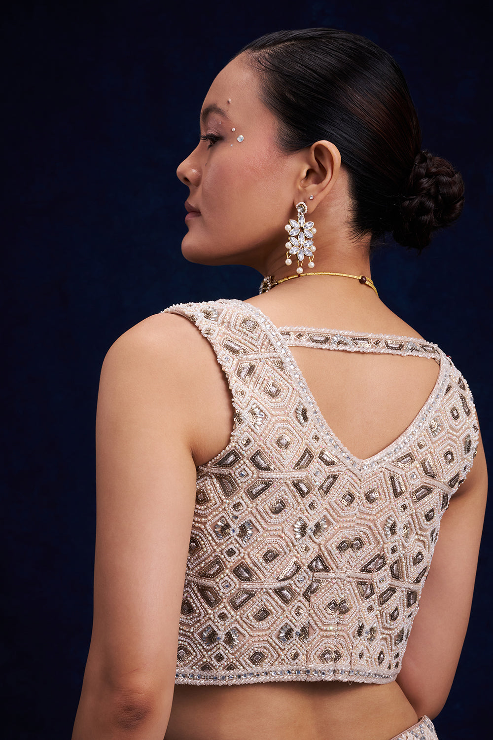 Ivory Gold Net Bridal Lehenga with Geometric Cutdana Work