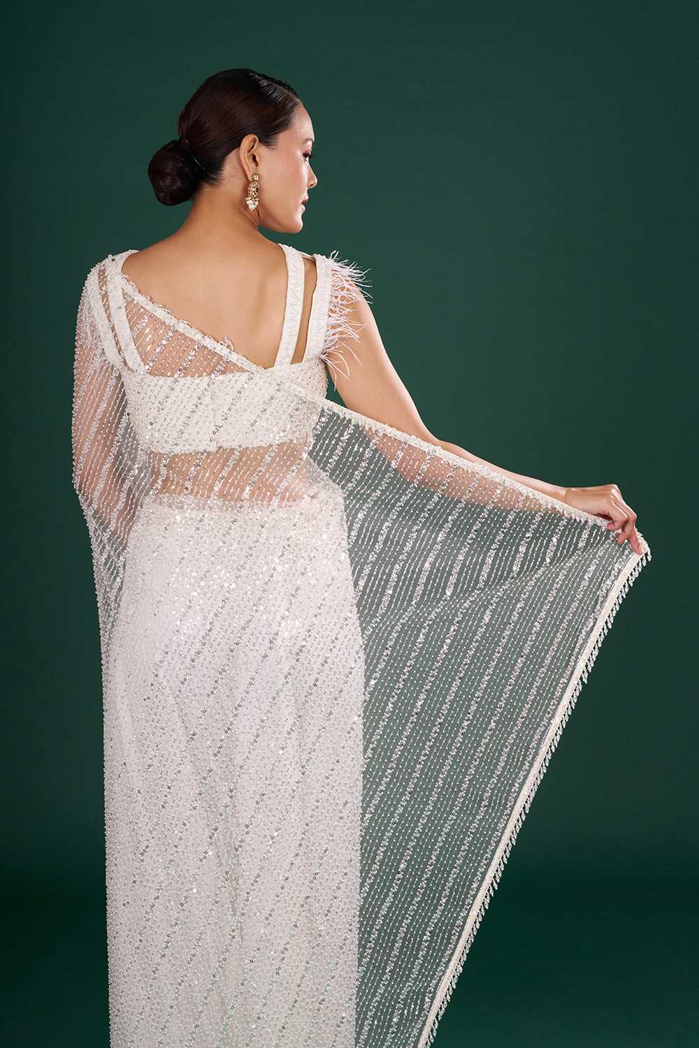 Off-White Net Saree in Linear Pattern and Unstitched Blouse