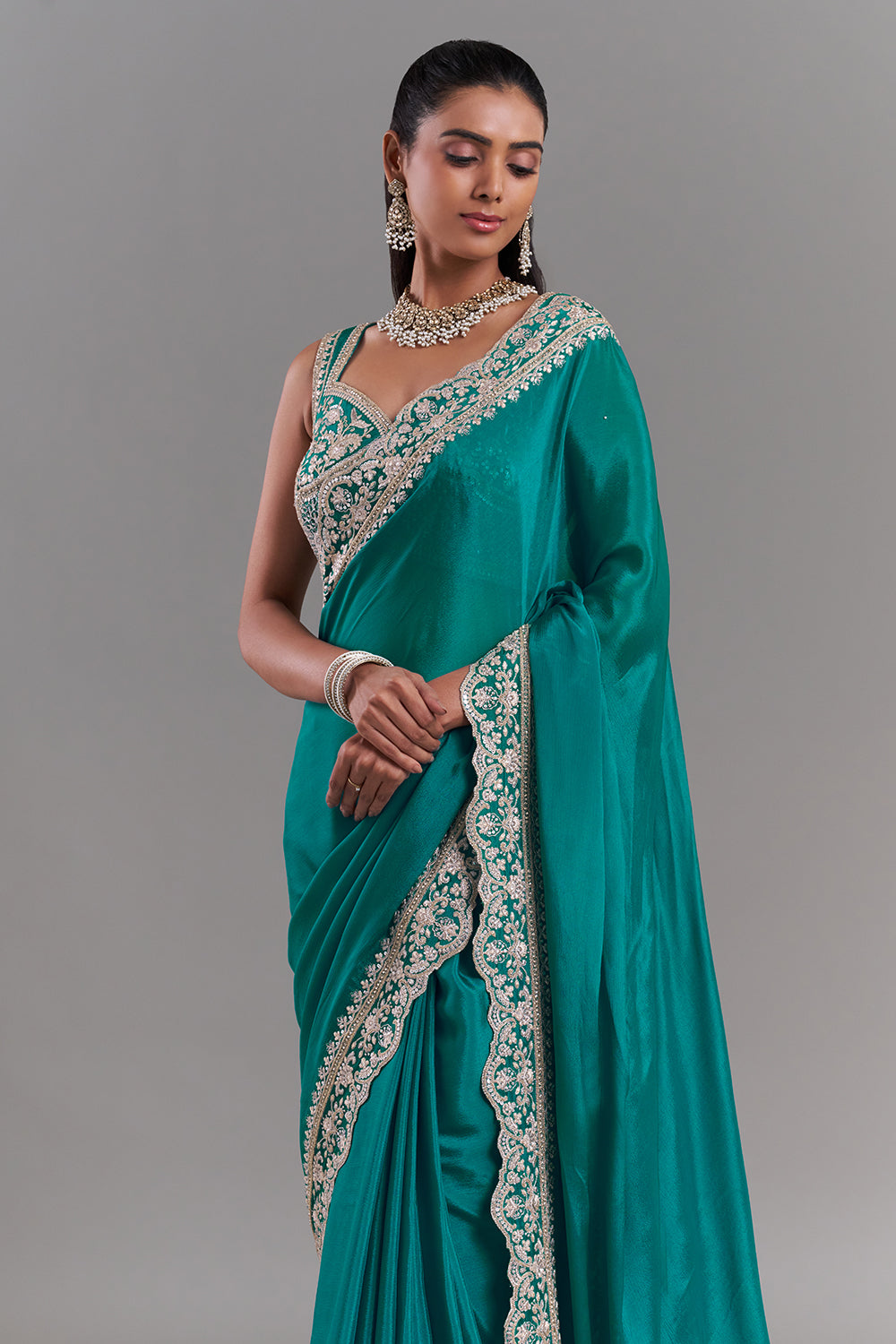 Teal Green Chiffon Saree with Ornate Embellished Border