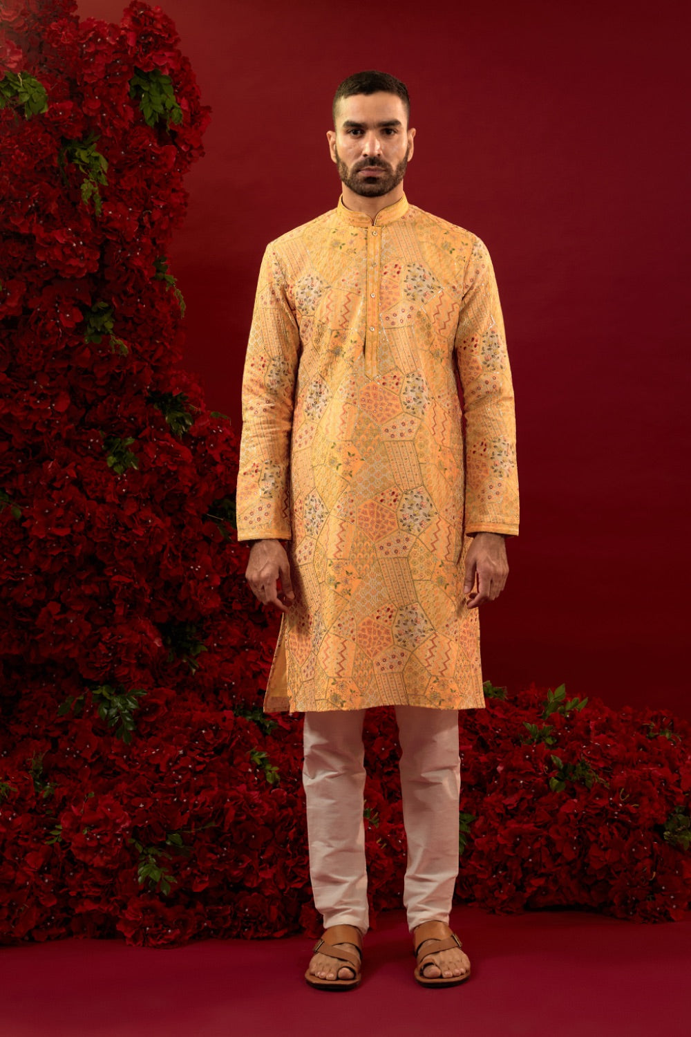 Orange silk kurta set with hand and machine work