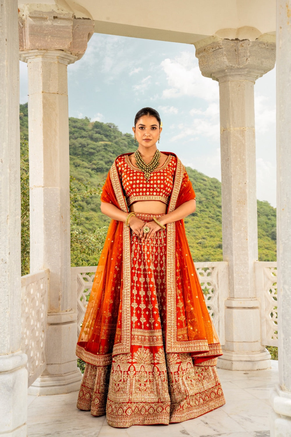 Coral orange raw silk lehenga choli with zardozi and hand cut dana work