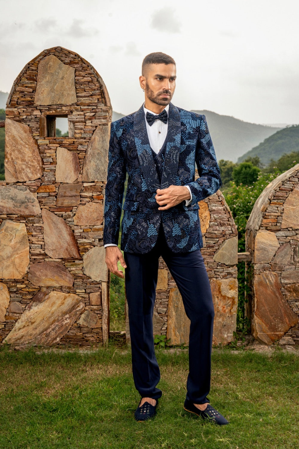 Blue five piece suiting tuxedo with pearl and hand cut dana work