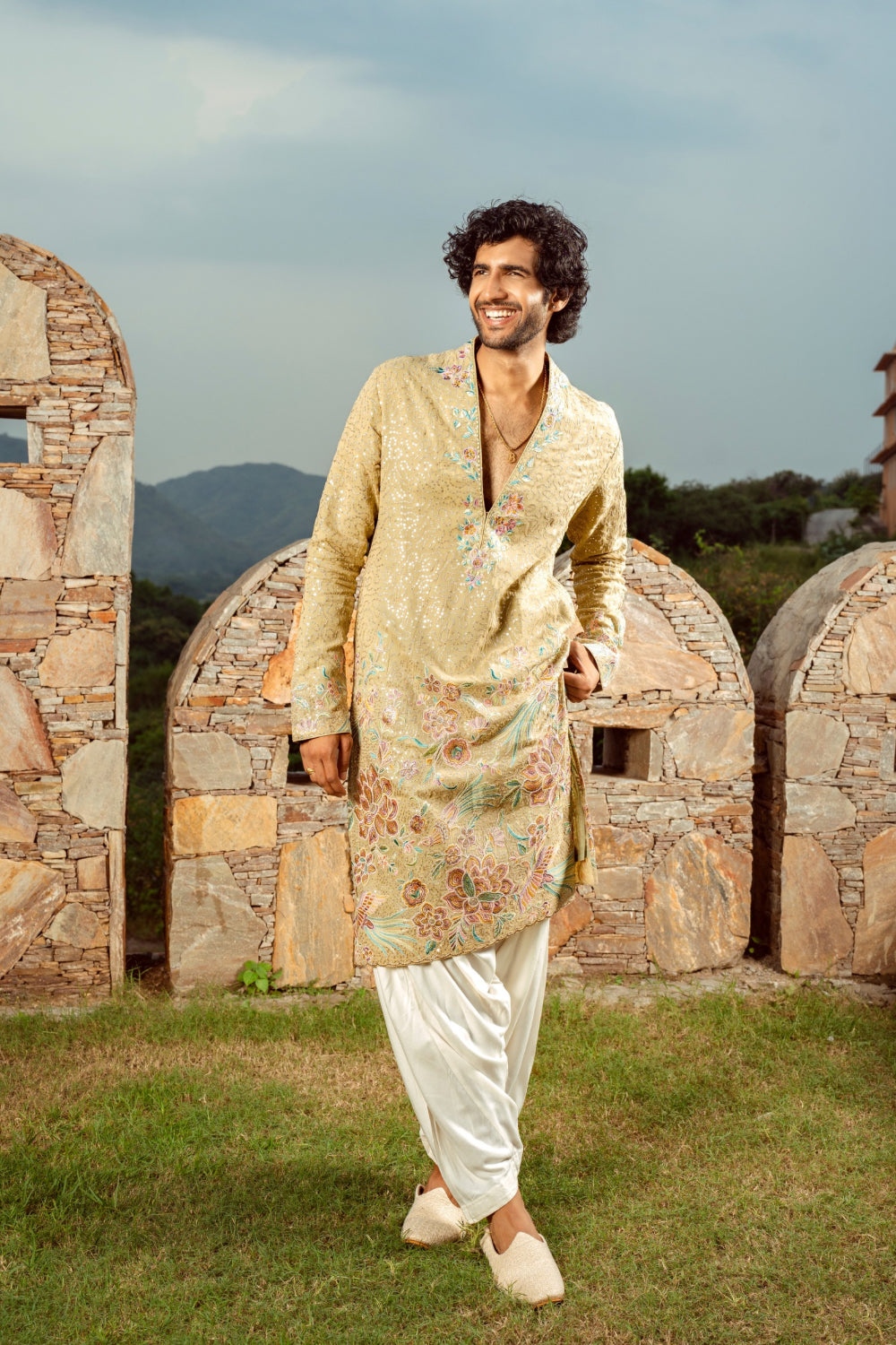 Pale golden kurta set with thread work and sequins work