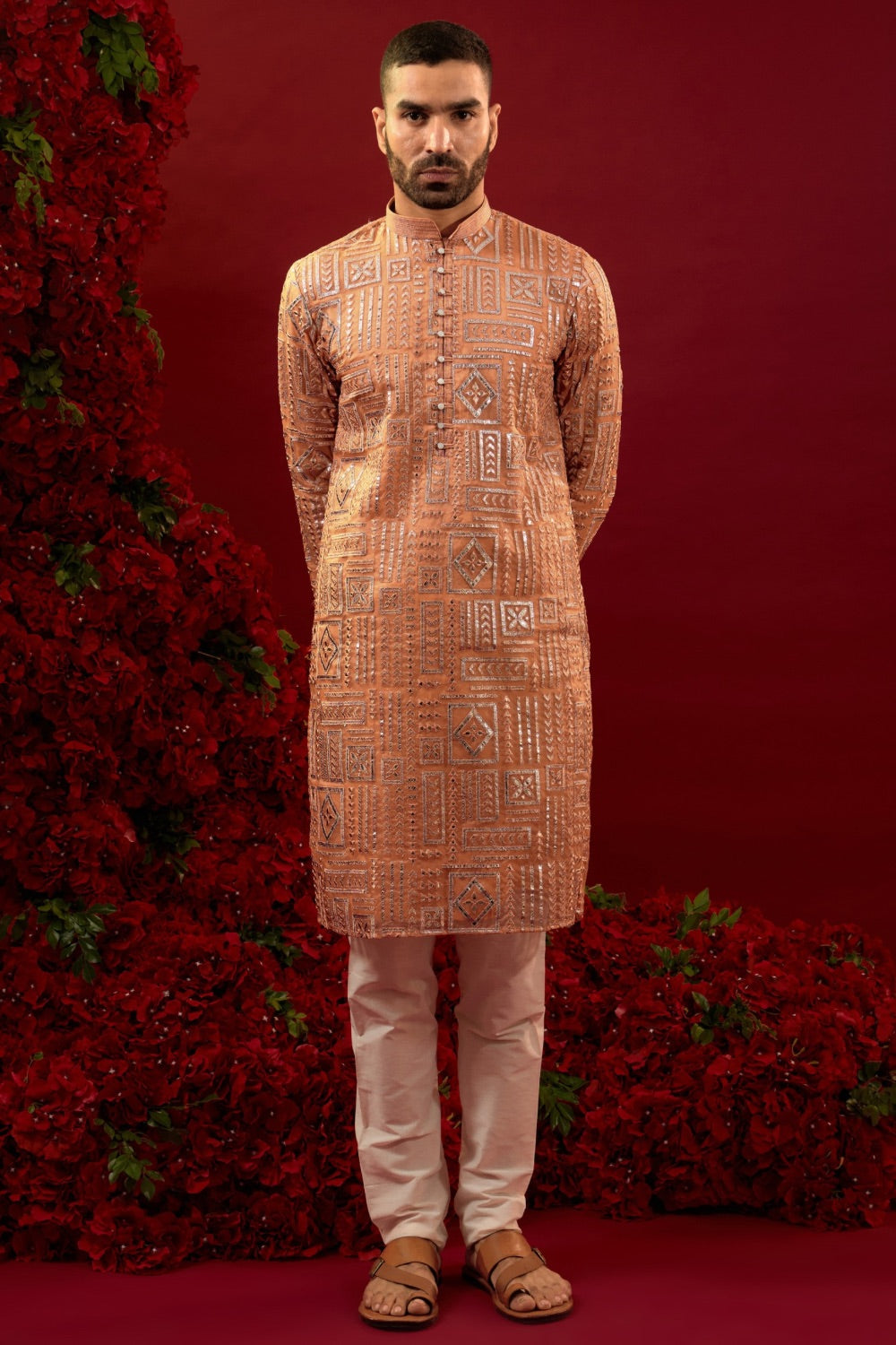 Orange silk kurta set with hand and machine work