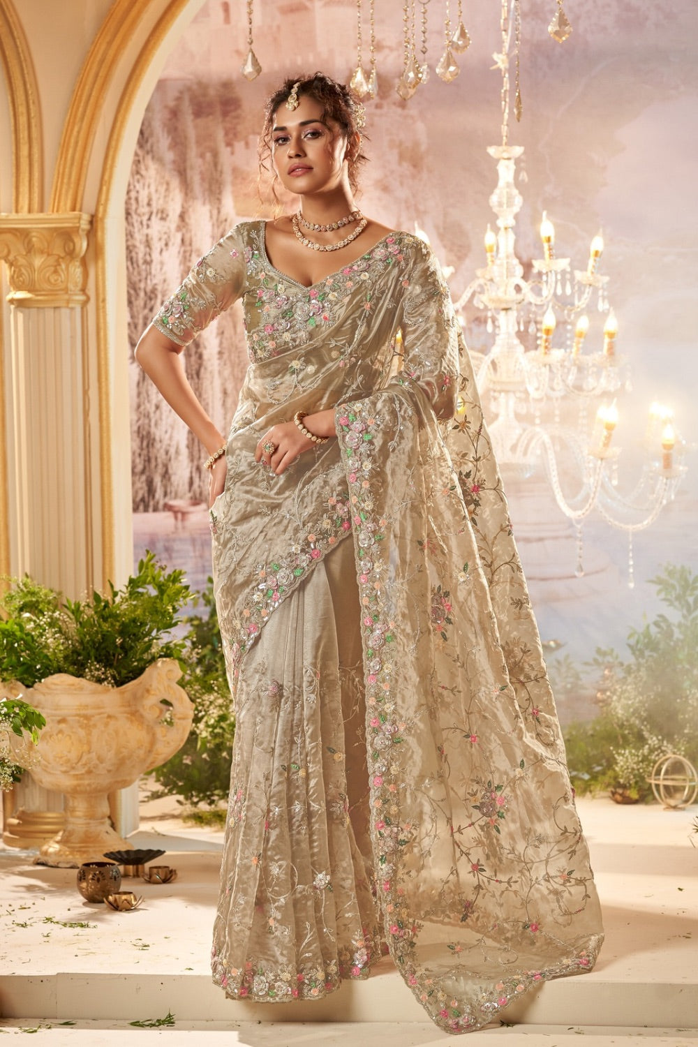 Champagne banarasi silk saree with matching unstitched blouse.