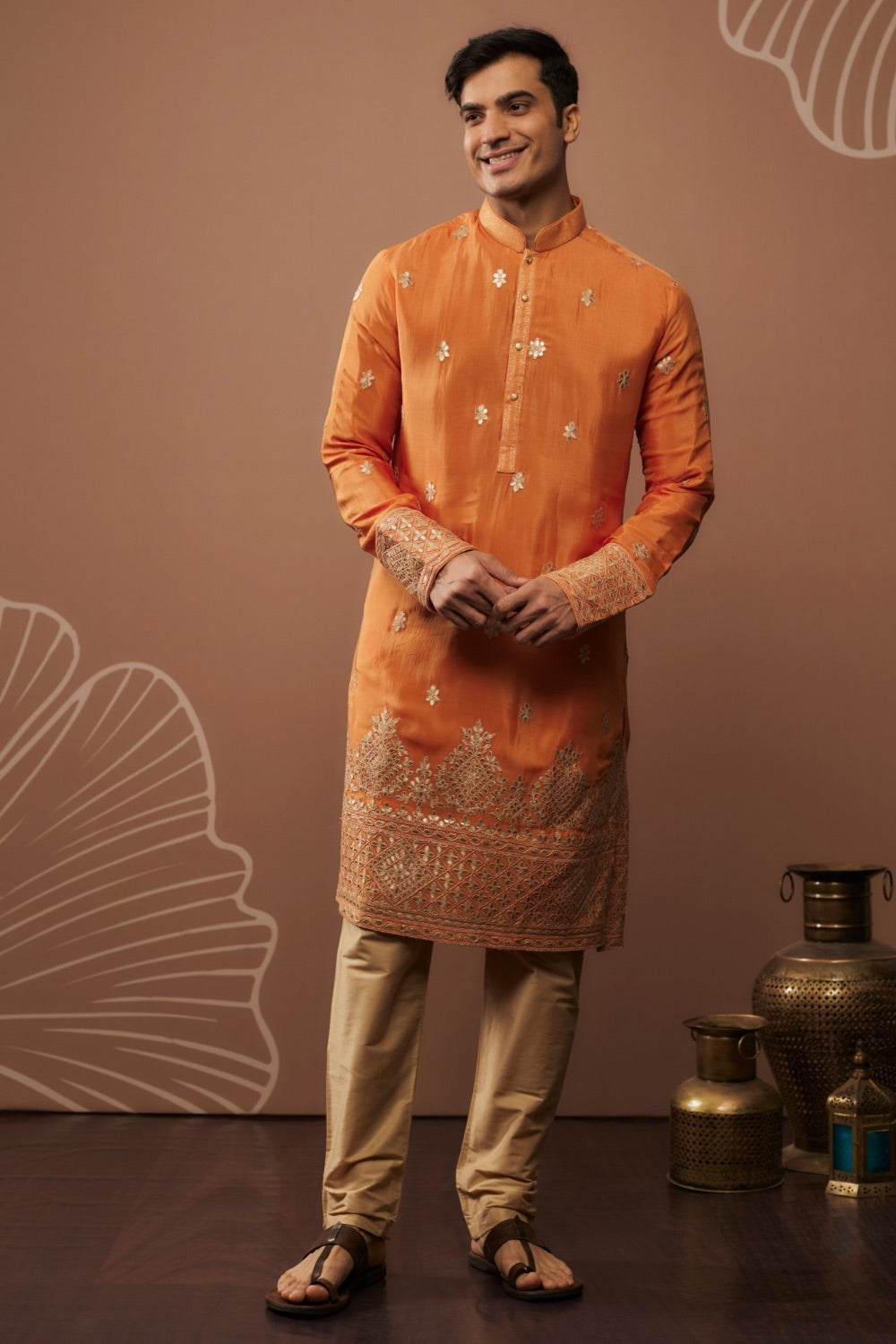 Orange silk kurta set with hand and machine work