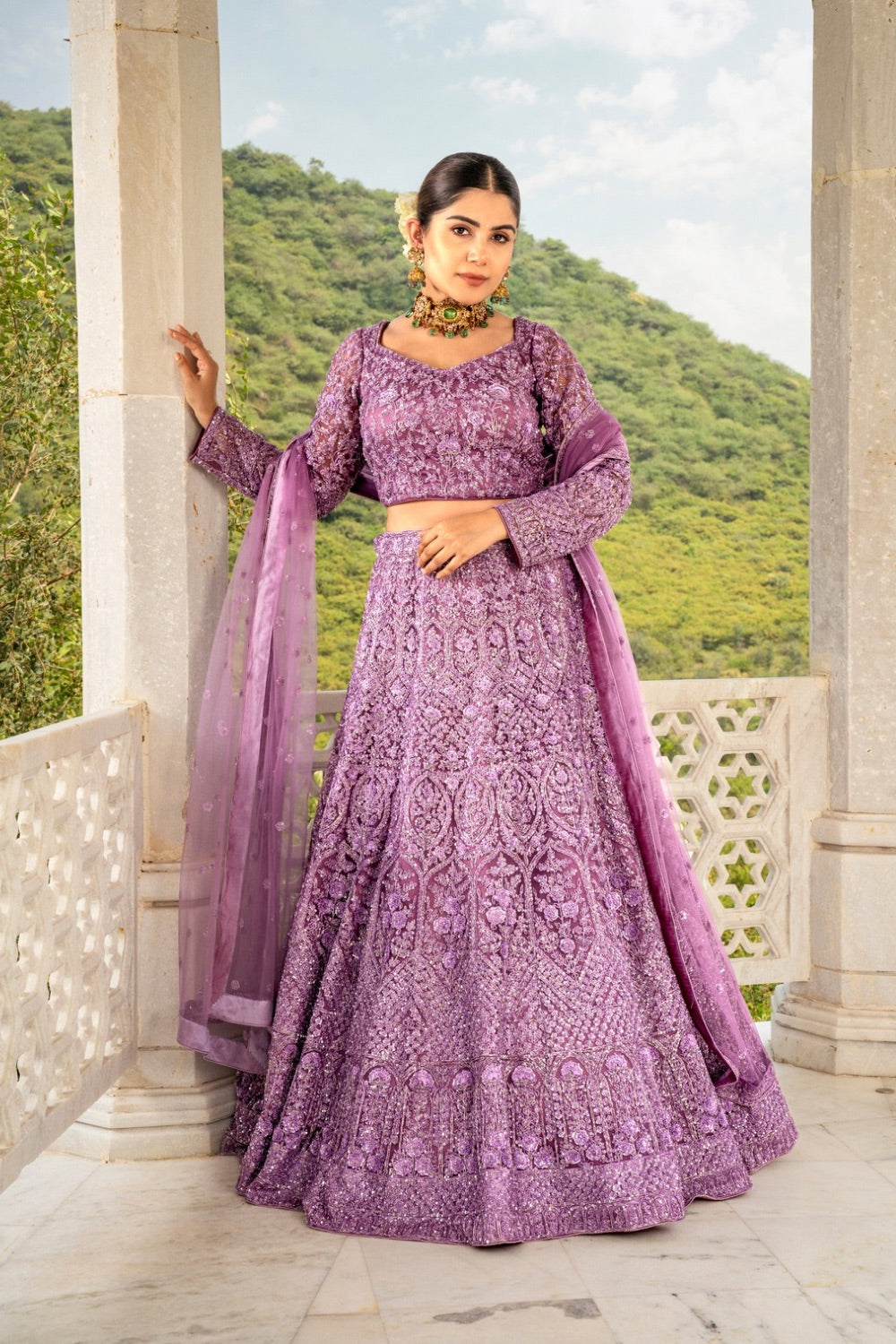 Purple net lehenga choli with sequins and hand cut dana work