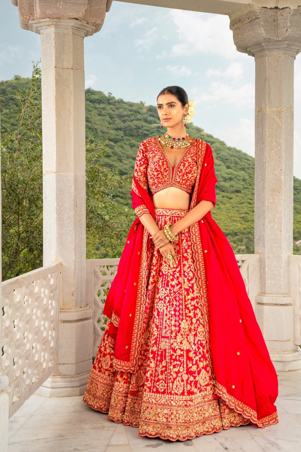 Bright red soft silk lehenga choli with zardozi and hand cut dana work