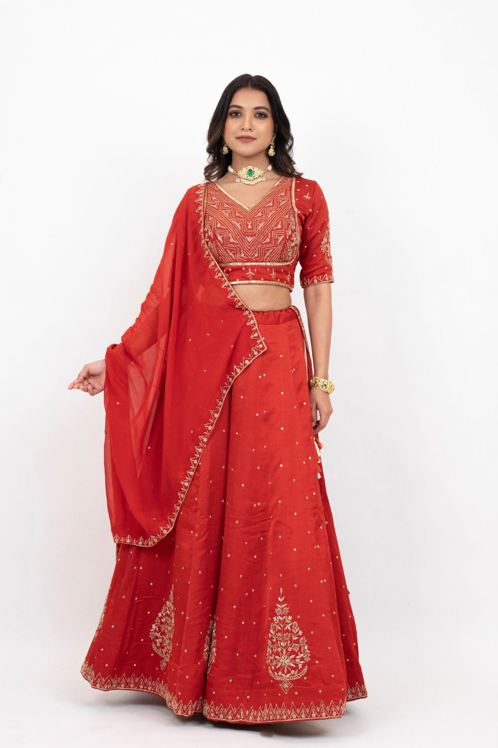 Rust soft silk zardozi embroidered lehenga choli with hand cut dana work