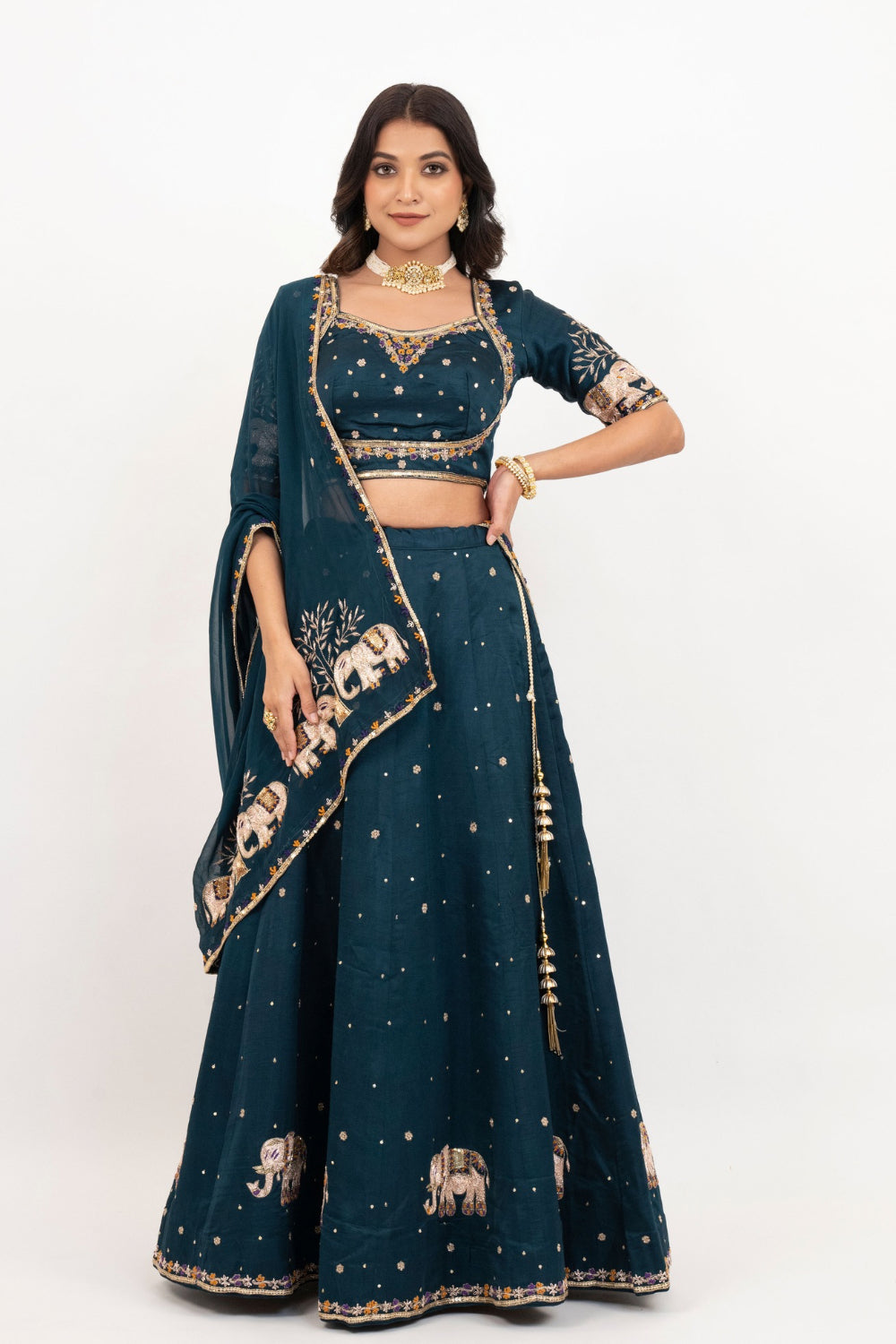 Peacock blue soft silk zardozi embroidered lehenga choli with hand cut dana work