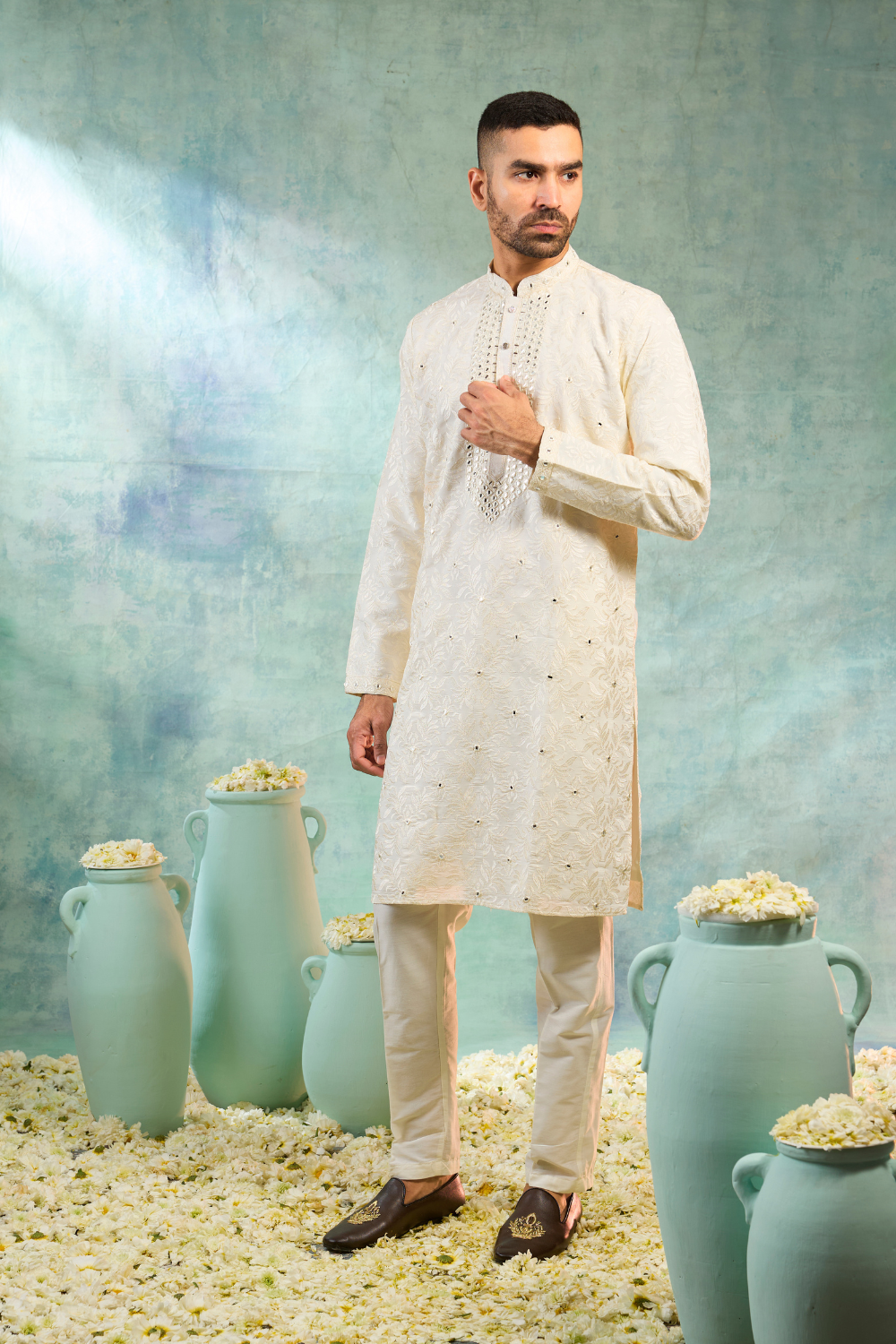 Ivory kurta set with thread embroidery and mirror work