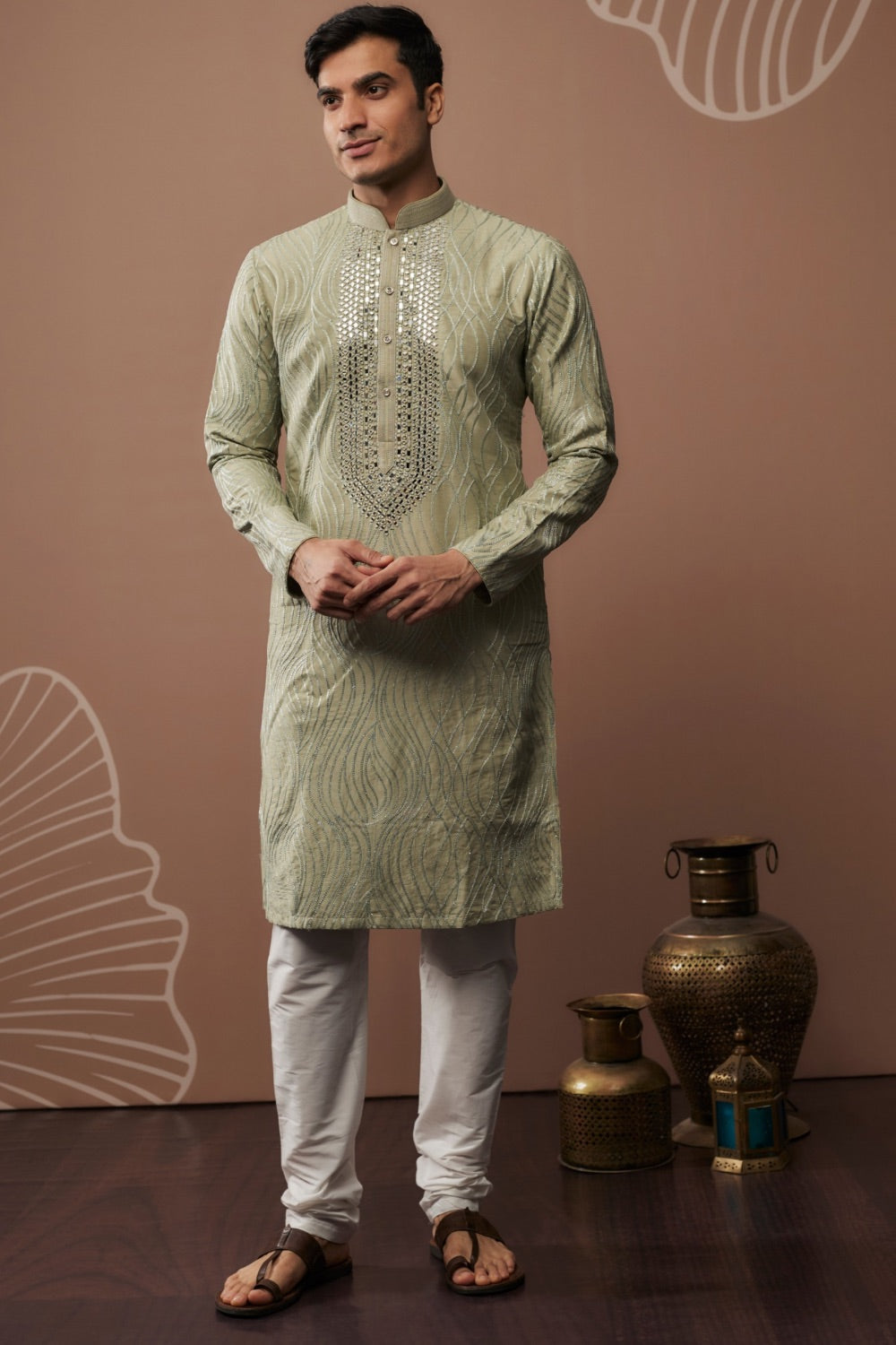 Sage green silk kurta set with hand and machine work