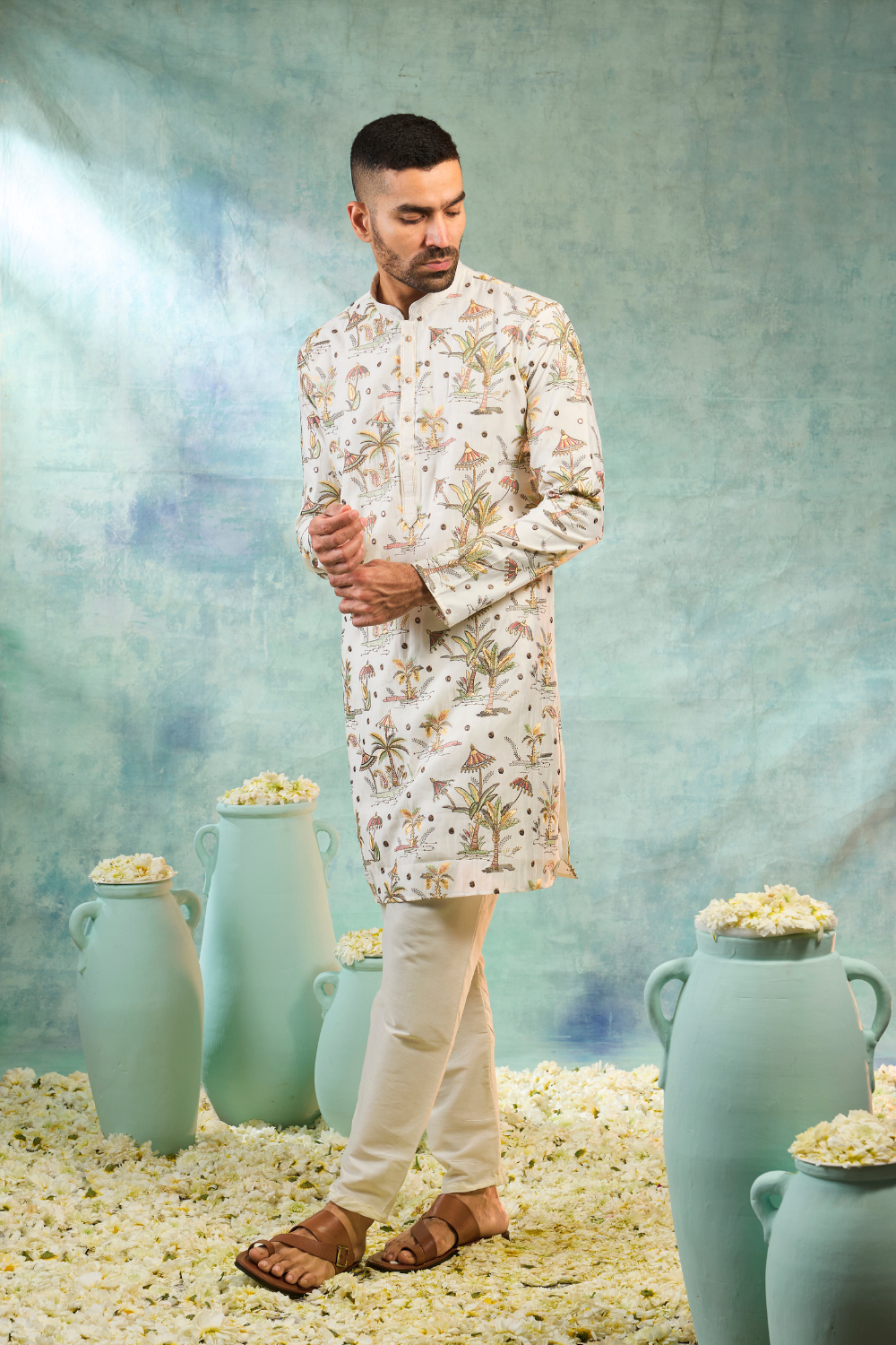 Ivory silk kurta set with multi coloured thread embroidery work