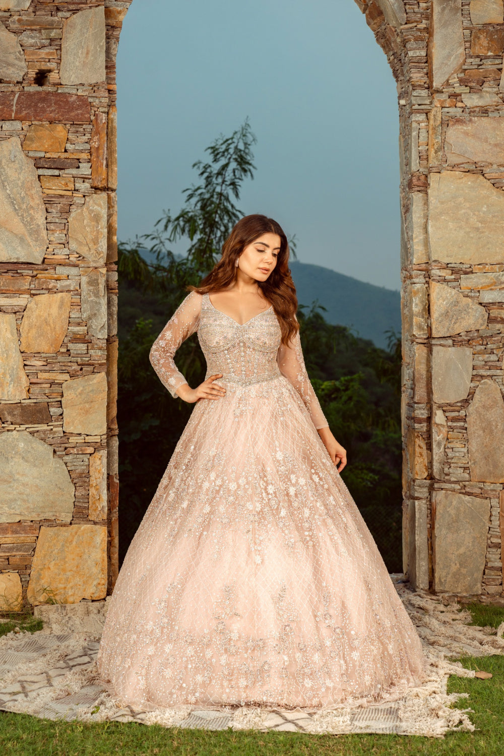 Baby pink net gown with sequins and stone work