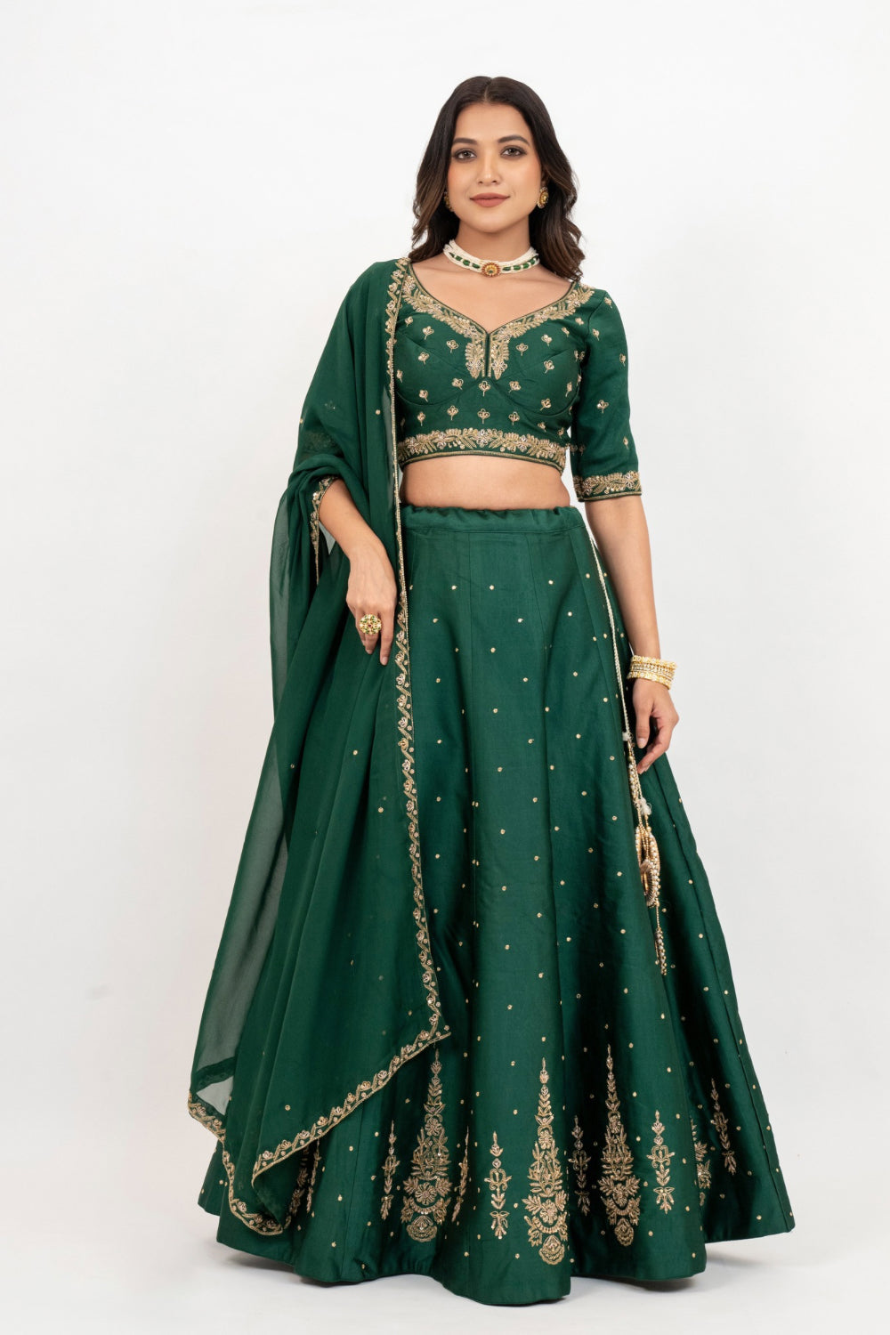 Bottle green soft silk zardozi embroidered lehenga choli with hand cut dana work