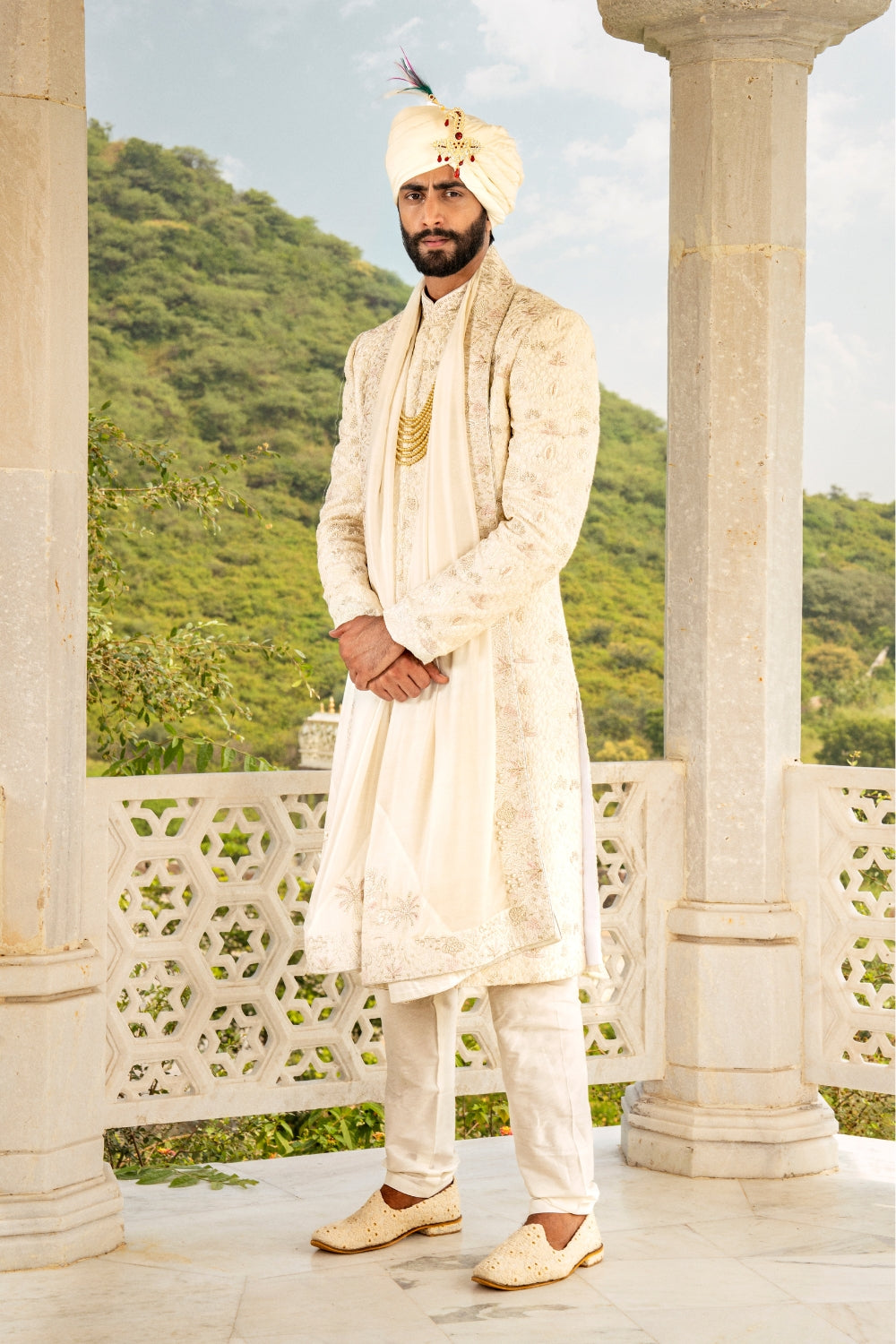 White silk sherwani with golden zardozi embroidery and moti work