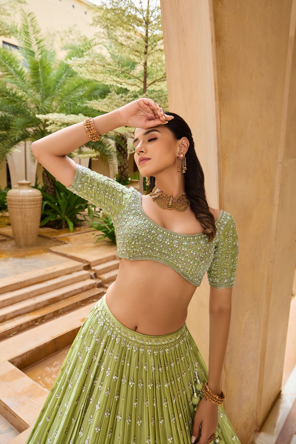 Palm green silk lehenga choli with sequins and hand cut dana work