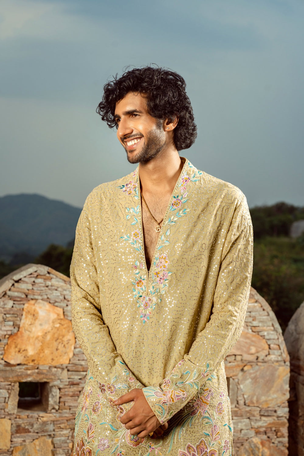 Pale golden kurta set with thread work and sequins work